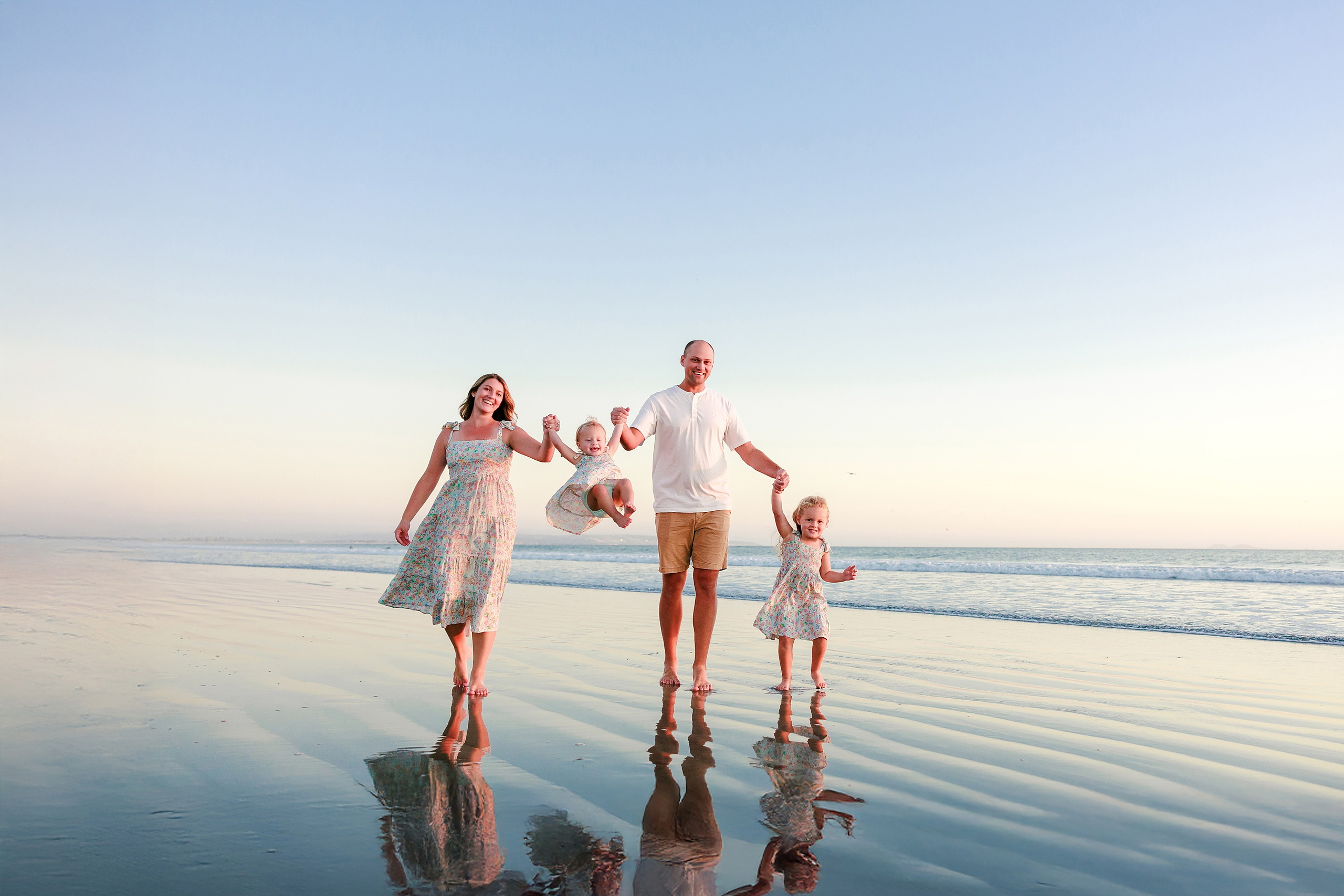 Hotel del Coronado Family Photos — 13 Hanna walking with both children through shallow water at Coronado