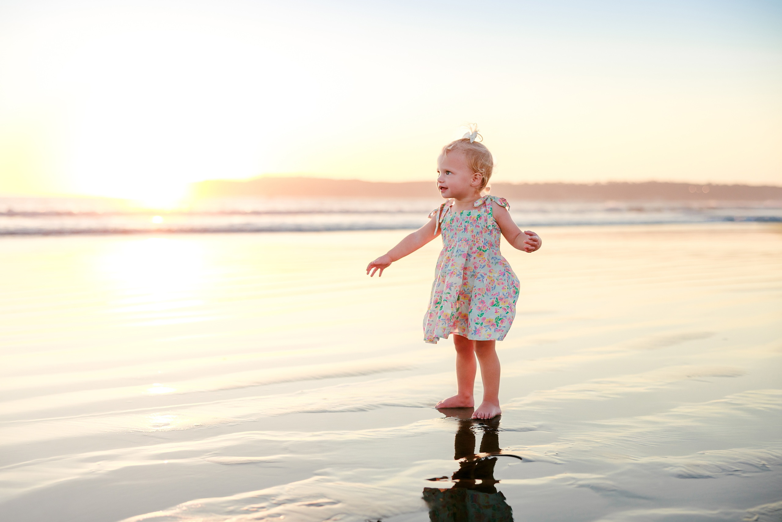 Hotel del Coronado Family Photos — 15 Father and toddler standing together in shallow water at Coronado