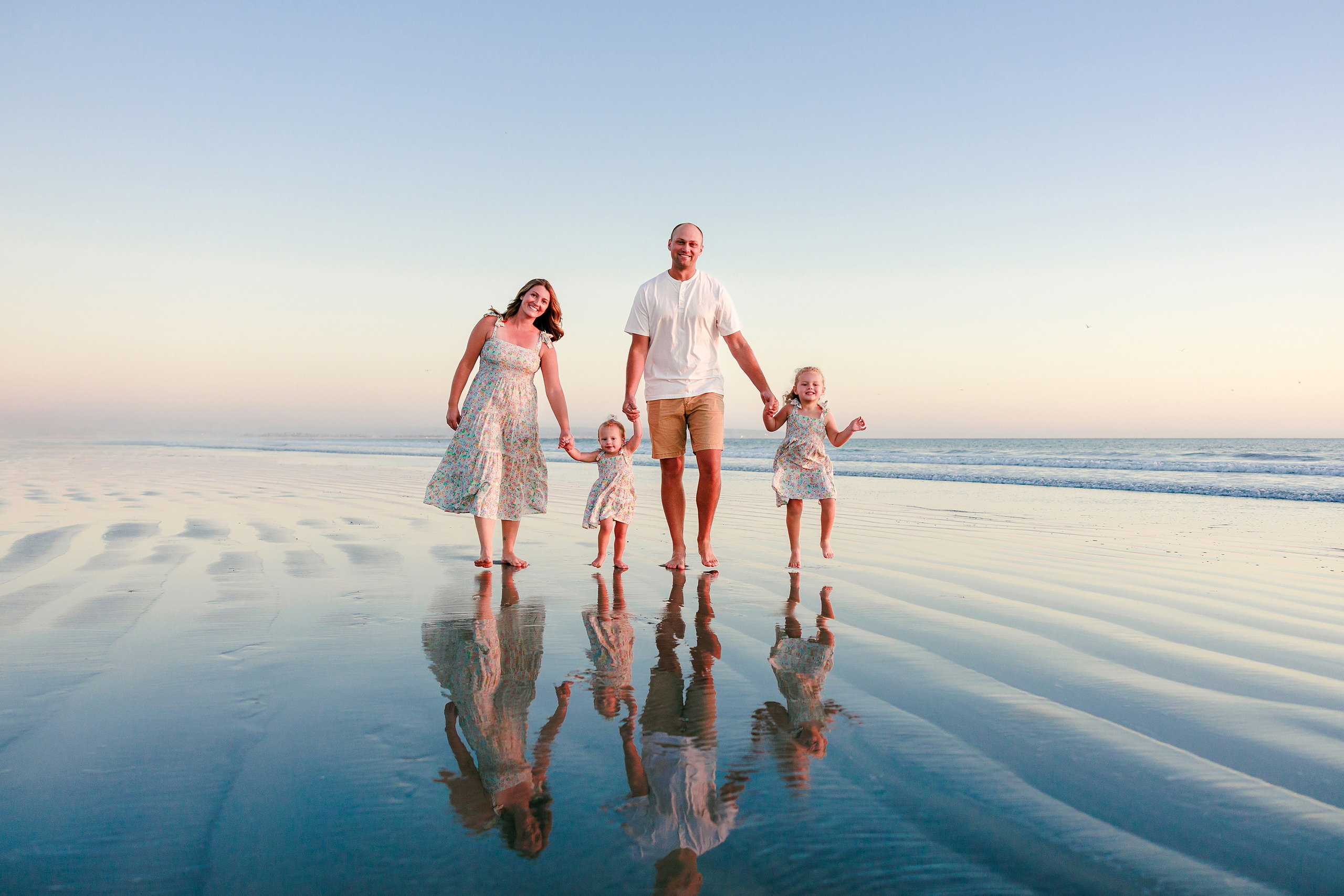 Hotel del Coronado Family Photos — 16 Hanna and Mabel walking hand-in-hand in shallow water at Coronado beach