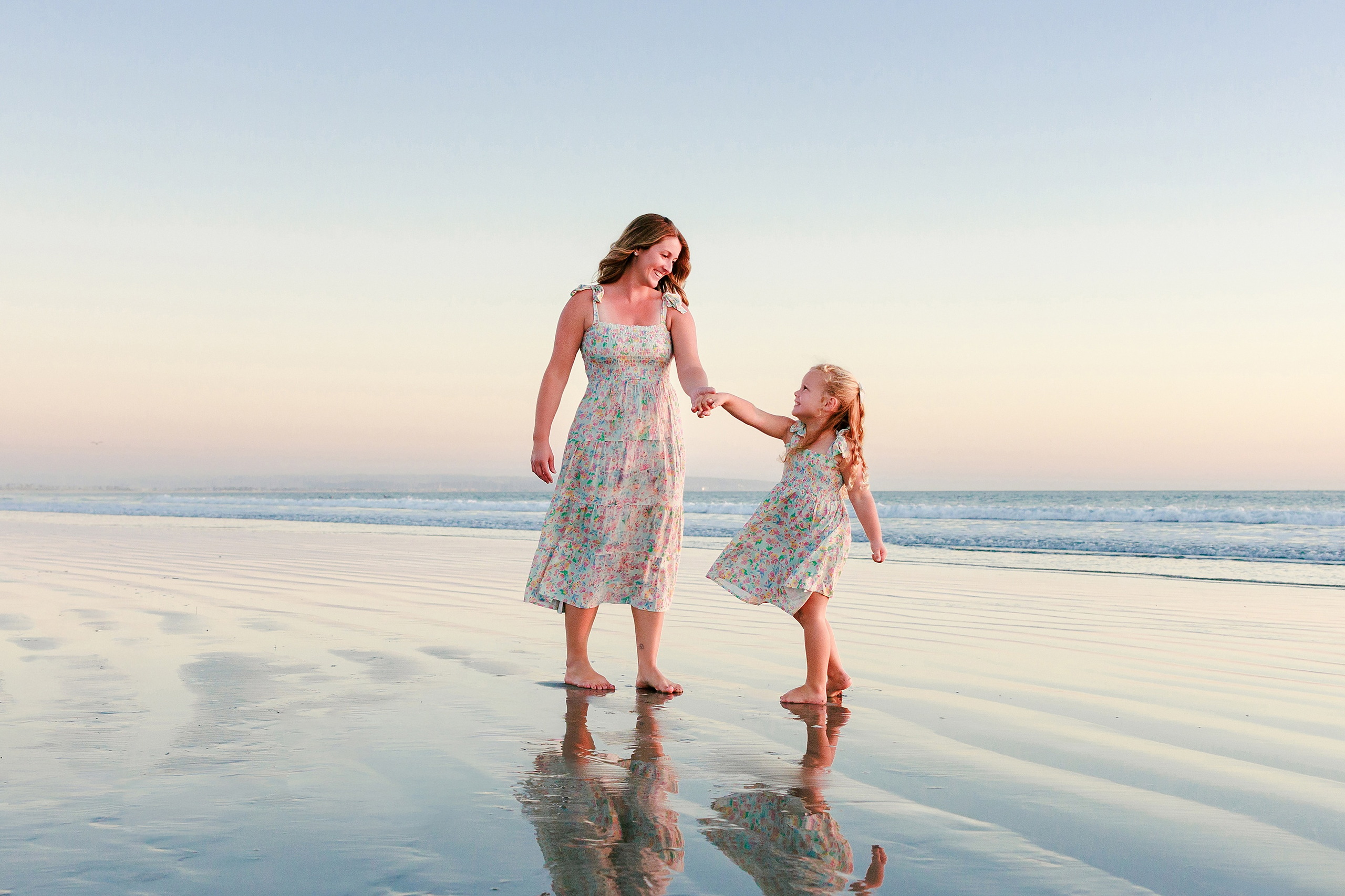 Hotel del Coronado Family Photos — 18 Mabel embracing her little sister Poppy in the Coronado water