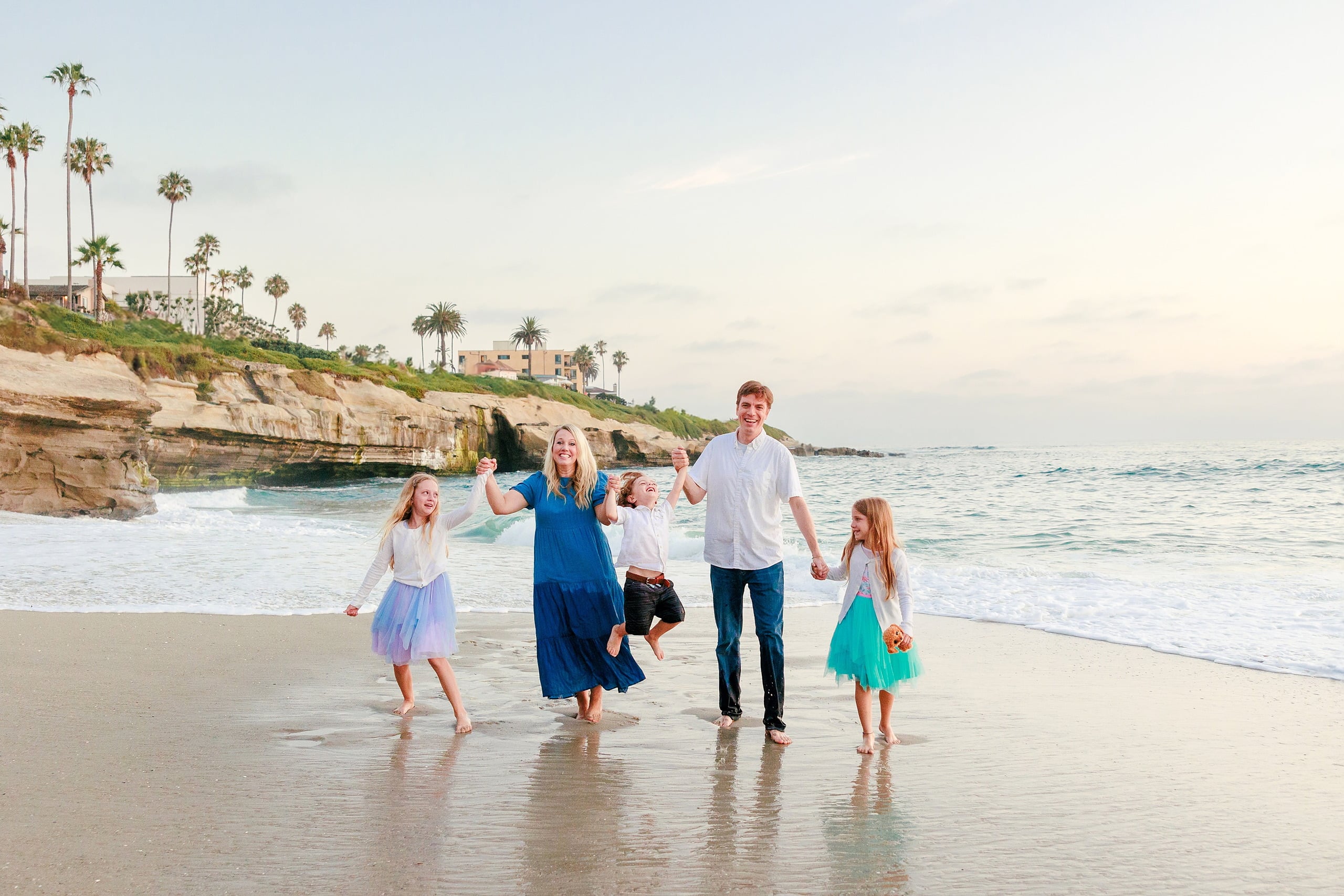 La Jolla Family Photography — 49 Family running in water at La Jolla with wave splashing