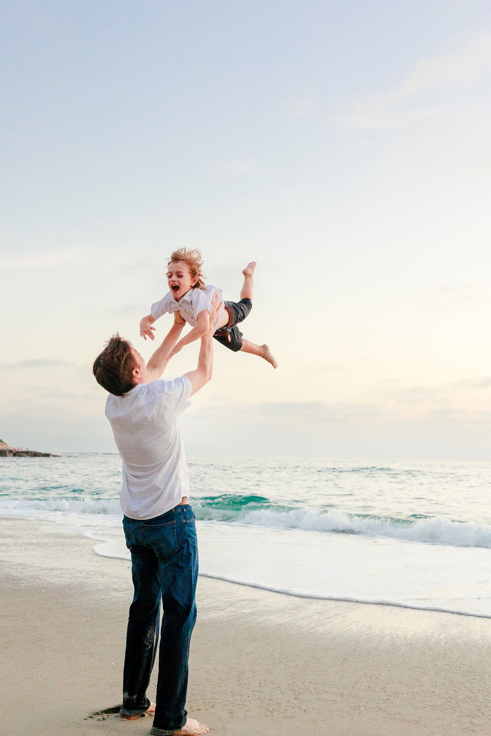 La Jolla Family Photography — 61 Family member on La Jolla beach during golden hour, portrait orientation