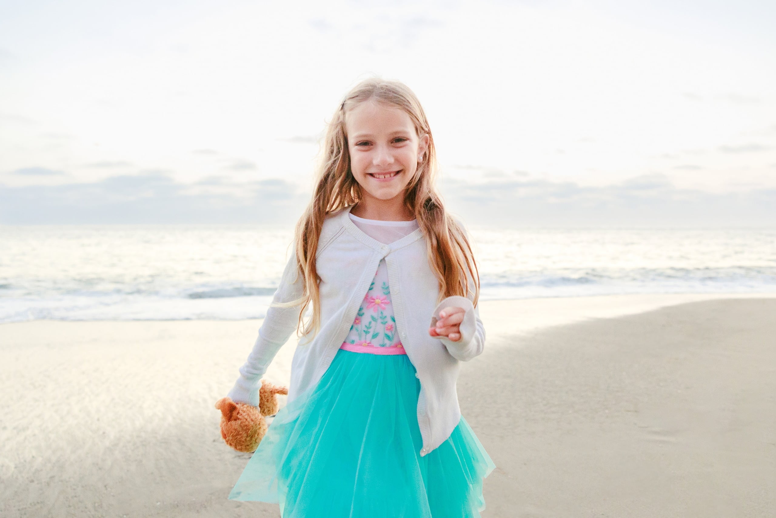 La Jolla Family Photography — 70 Girl in white and turquoise tulle holding teddy bear on beach
