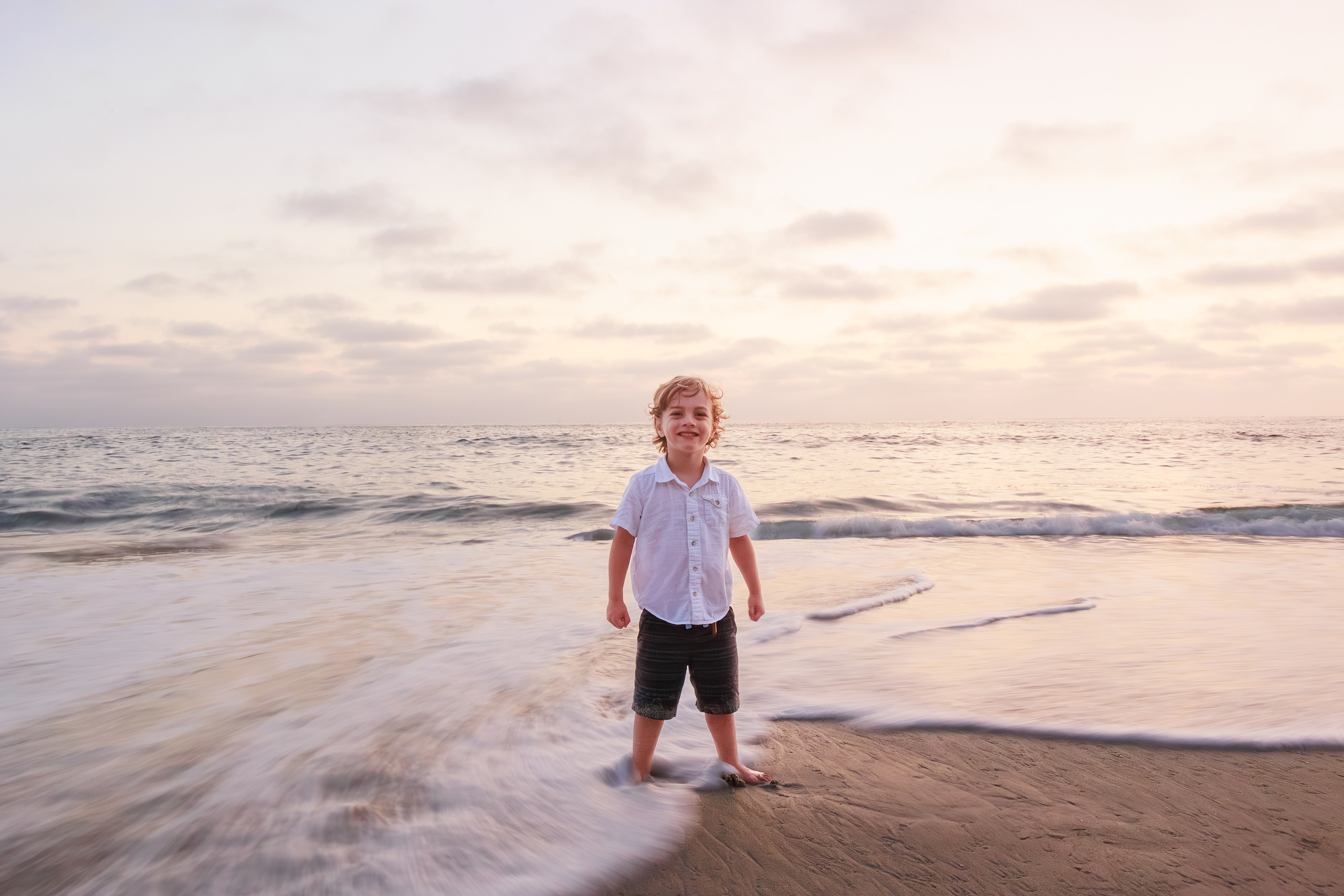 La Jolla Family Photography — 72 Toddler standing in shallow surf at La Jolla at dawn
