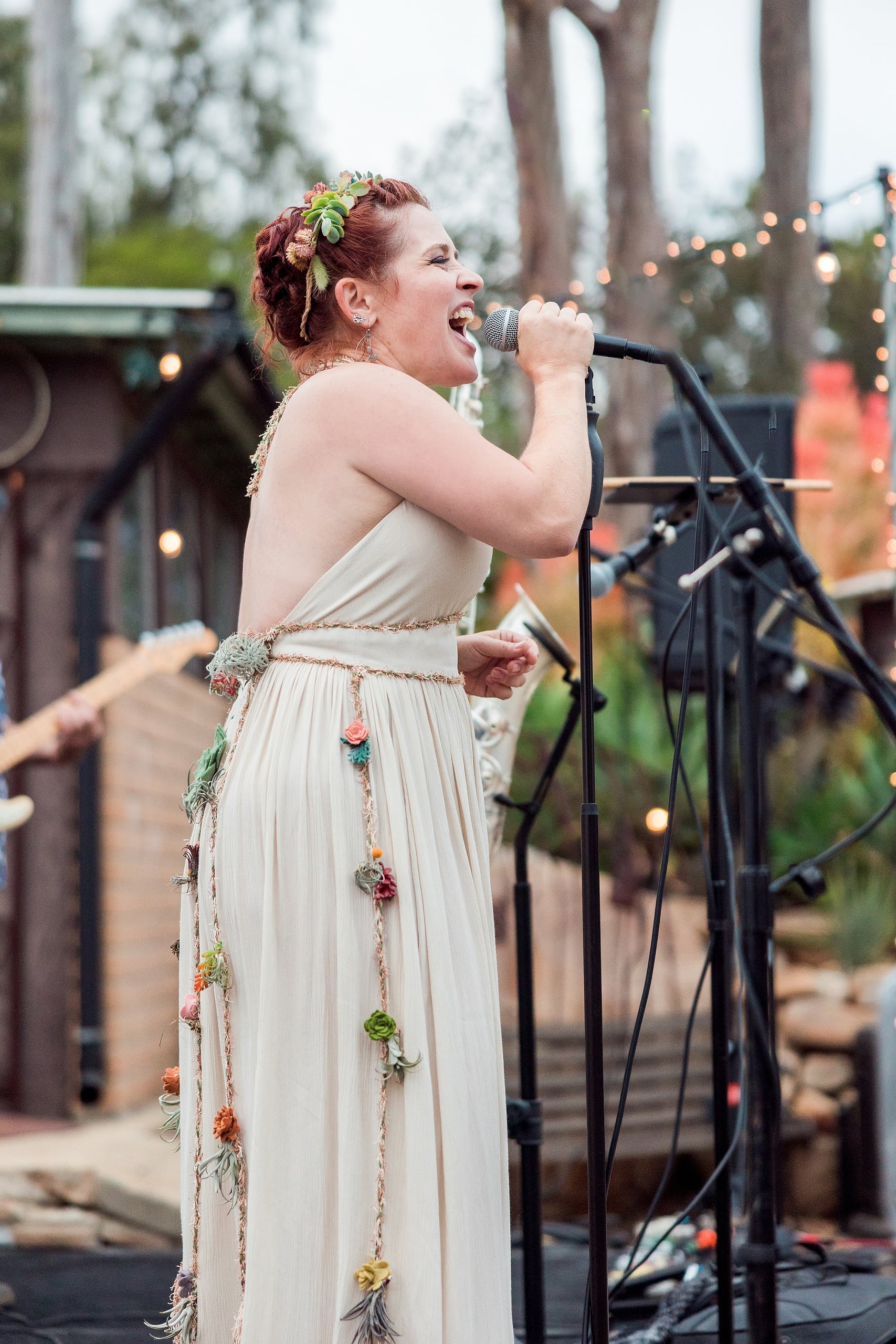 Moriah & Greg’s Wedding — 117 Groom extends his arm to lead his bride through dance move with obvious affection