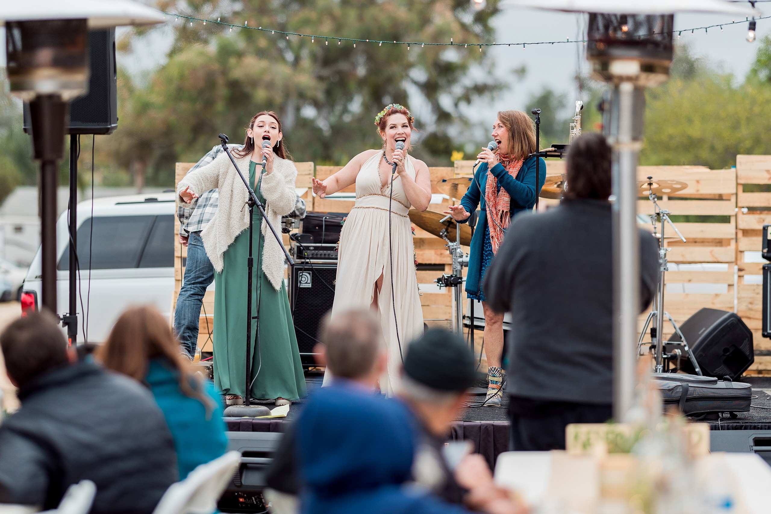 Moriah & Greg’s Wedding — 119 Fire pits cast warm glow across gathered guests during evening garden celebration
