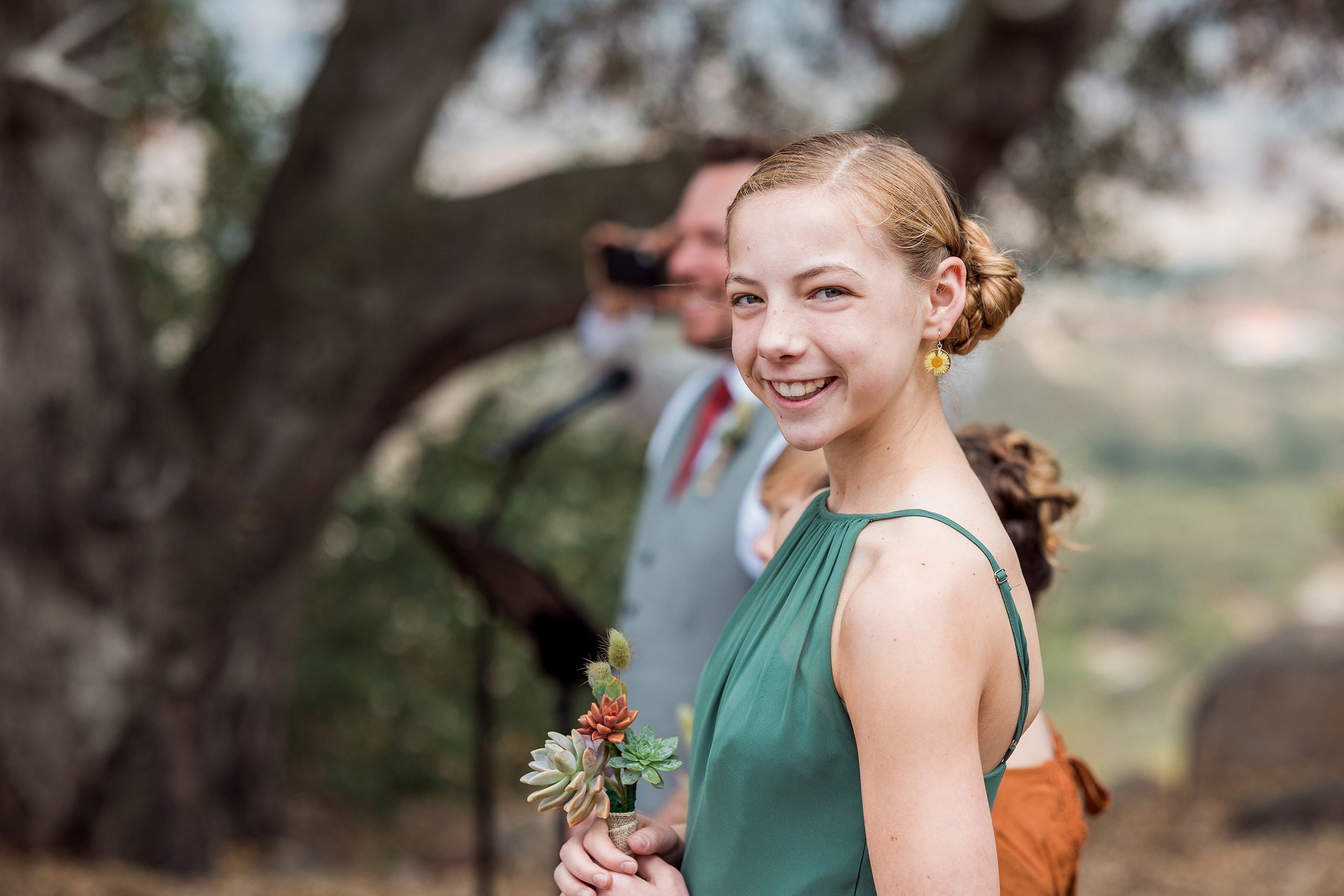 Moriah & Greg’s Wedding — 15 Wide shot of gathered guests celebrating in the quirky garden setting with succulents