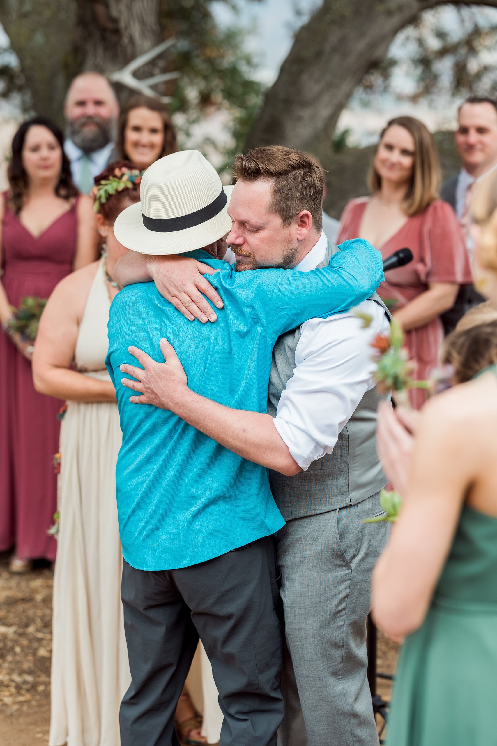 Moriah & Greg’s Wedding — 26 Bride and groom share an intimate slow dance surrounded by succulent plants and guests