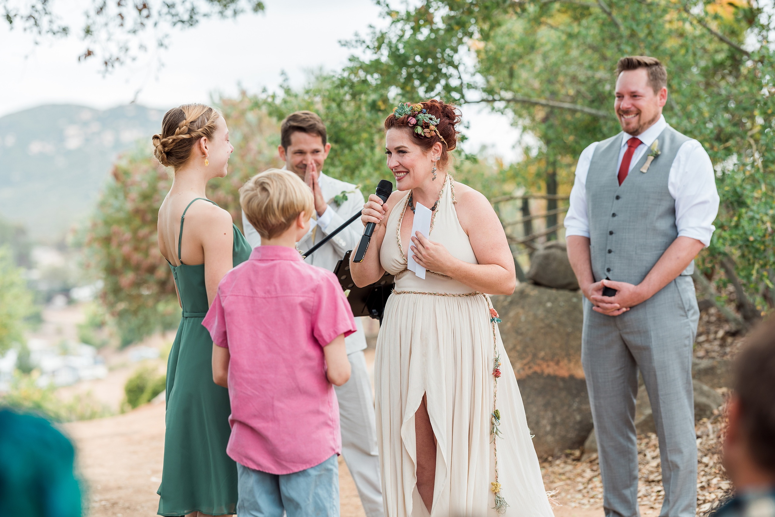 Moriah & Greg’s Wedding — 32 Groom looks at his bride with deep affection and love among the succulent plants