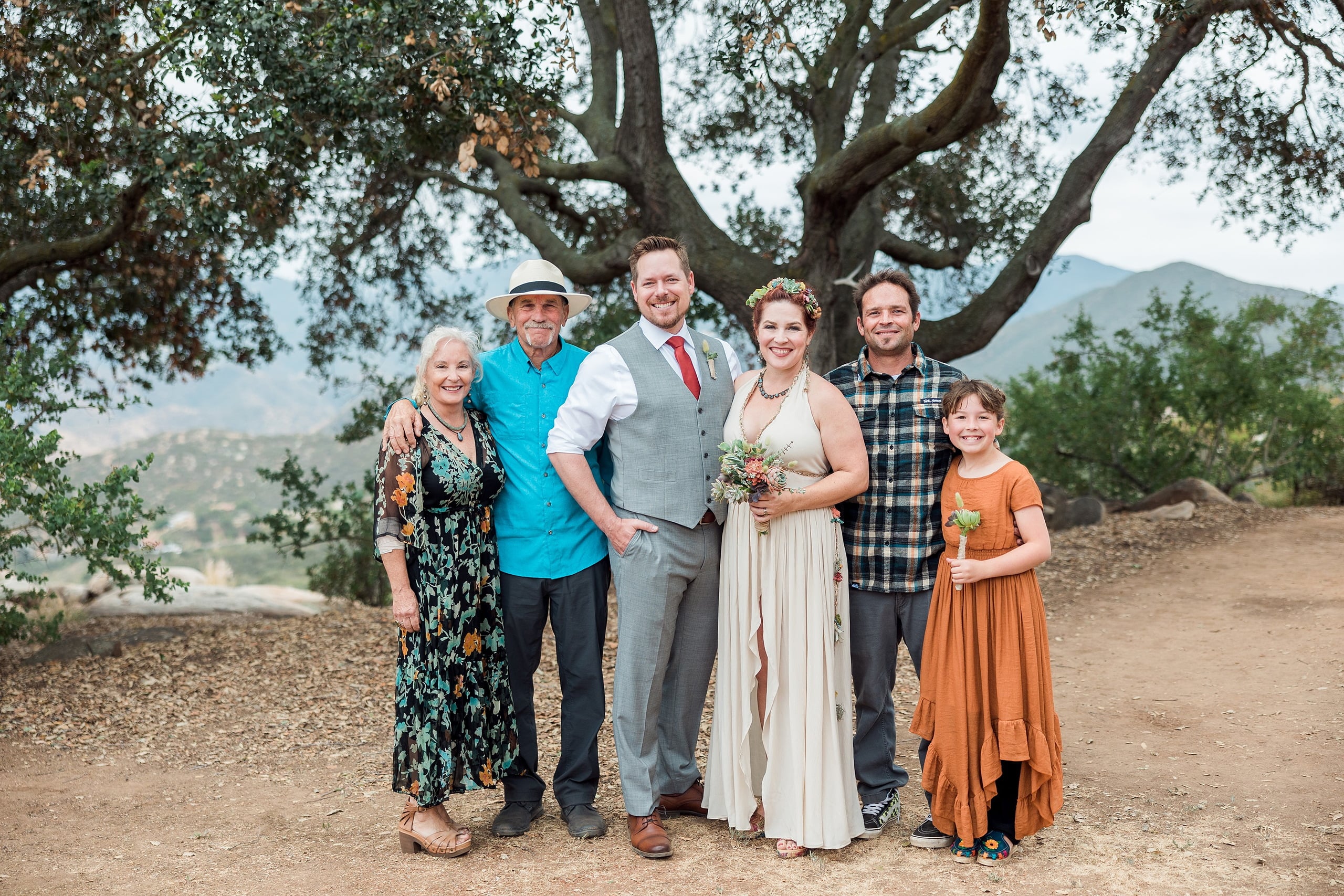 Moriah & Greg’s Wedding — 53 Candid moment captures genuine joy and laughter from guest during garden wedding