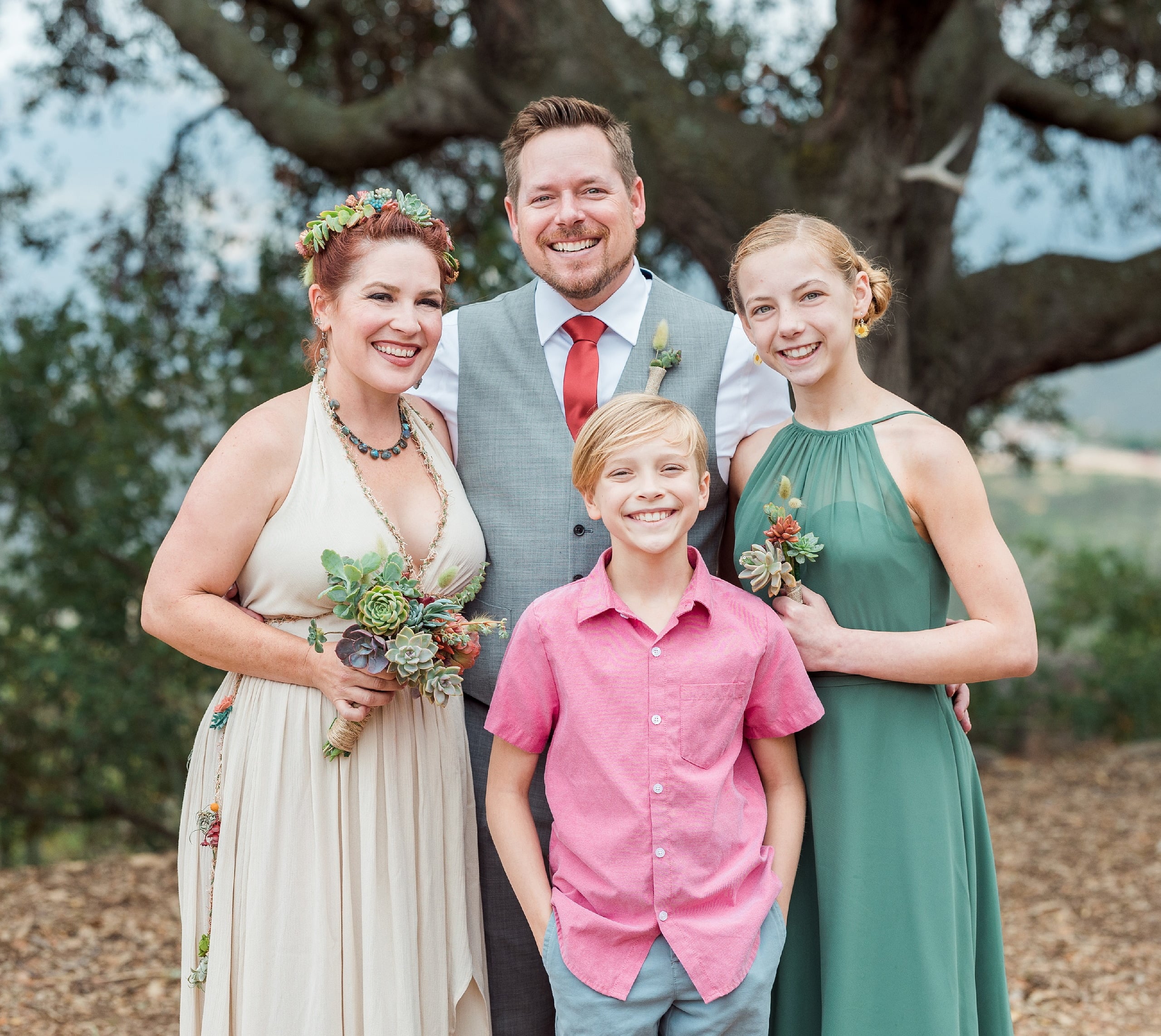 Moriah & Greg’s Wedding — 57 Groom and bride stand together at edge of succulent garden during golden hour light
