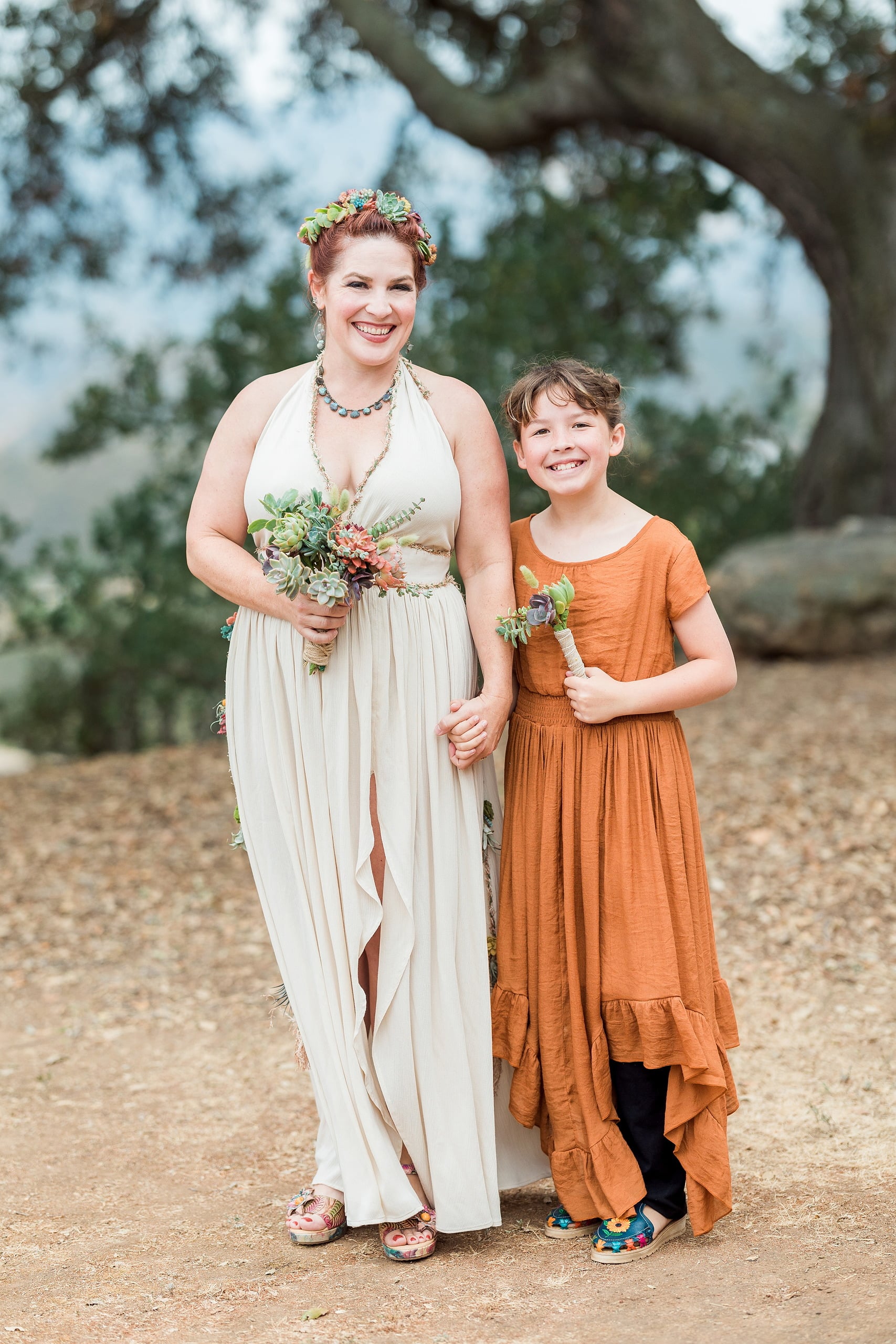 Moriah & Greg’s Wedding — 59 Mason jars used as decoration and drinkware sit among succulent plants in venue
