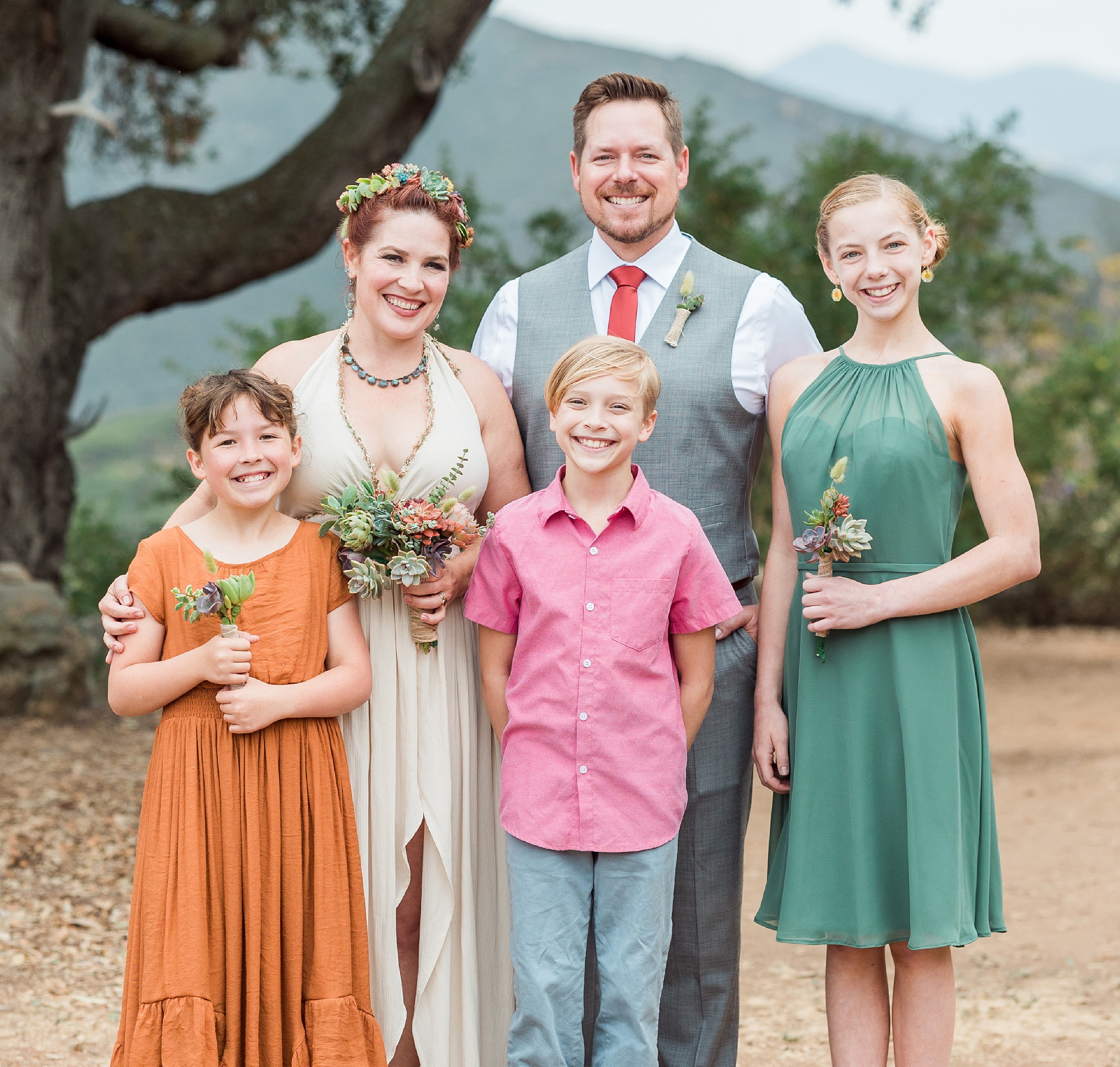 Moriah & Greg’s Wedding — 62 Groom extends his hand to his bride for dance among gathered guests and succulents