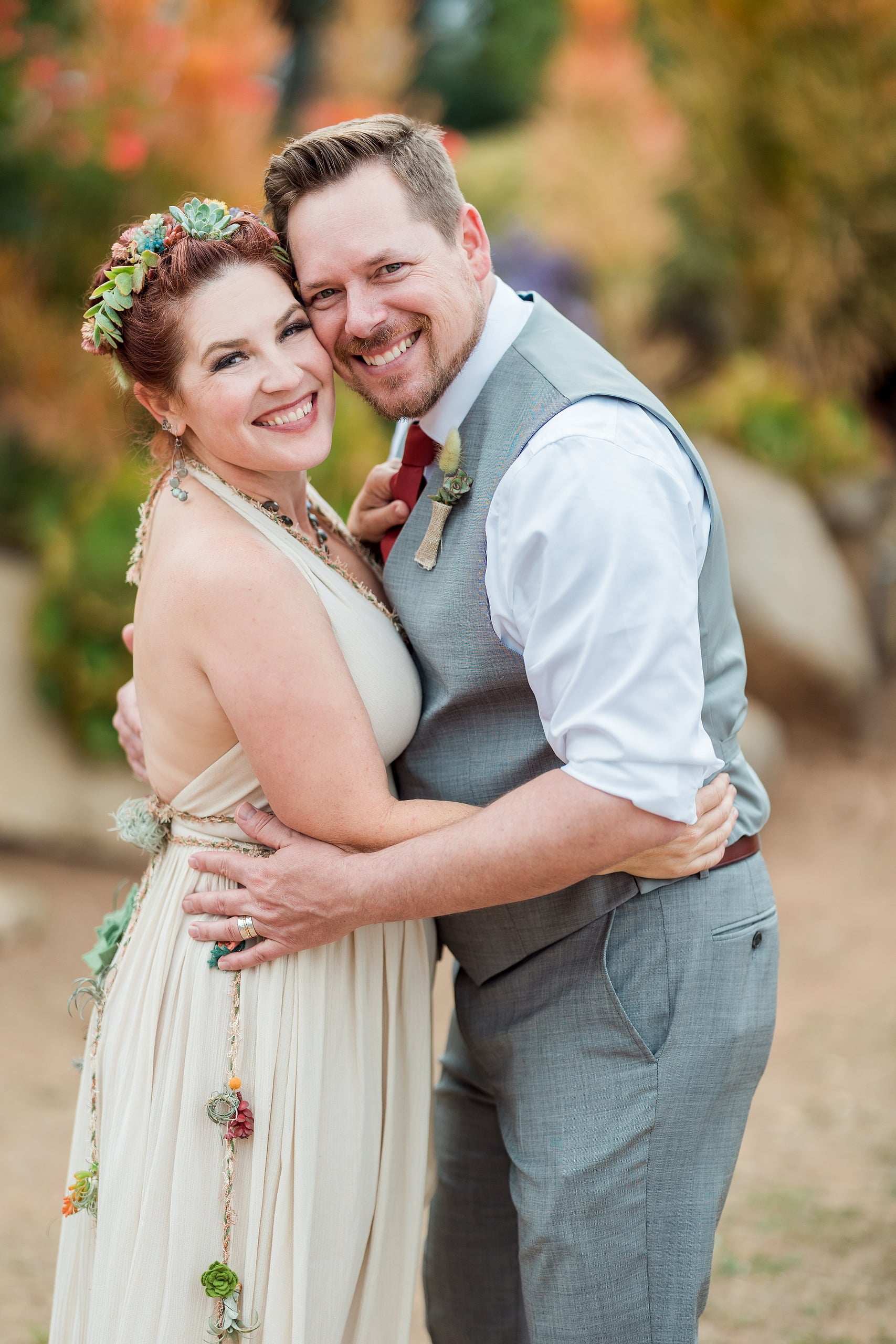 Moriah & Greg’s Wedding — 93 Fire pit glows warmly as guests gather around it during evening garden celebration