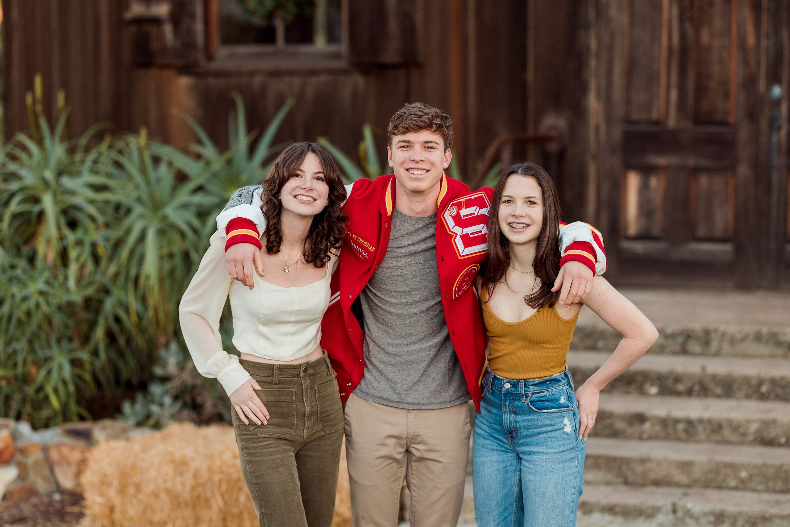 Photographer San Diego — 22 Three siblings in front of Olivenhain Town Hall, boy in red jacket