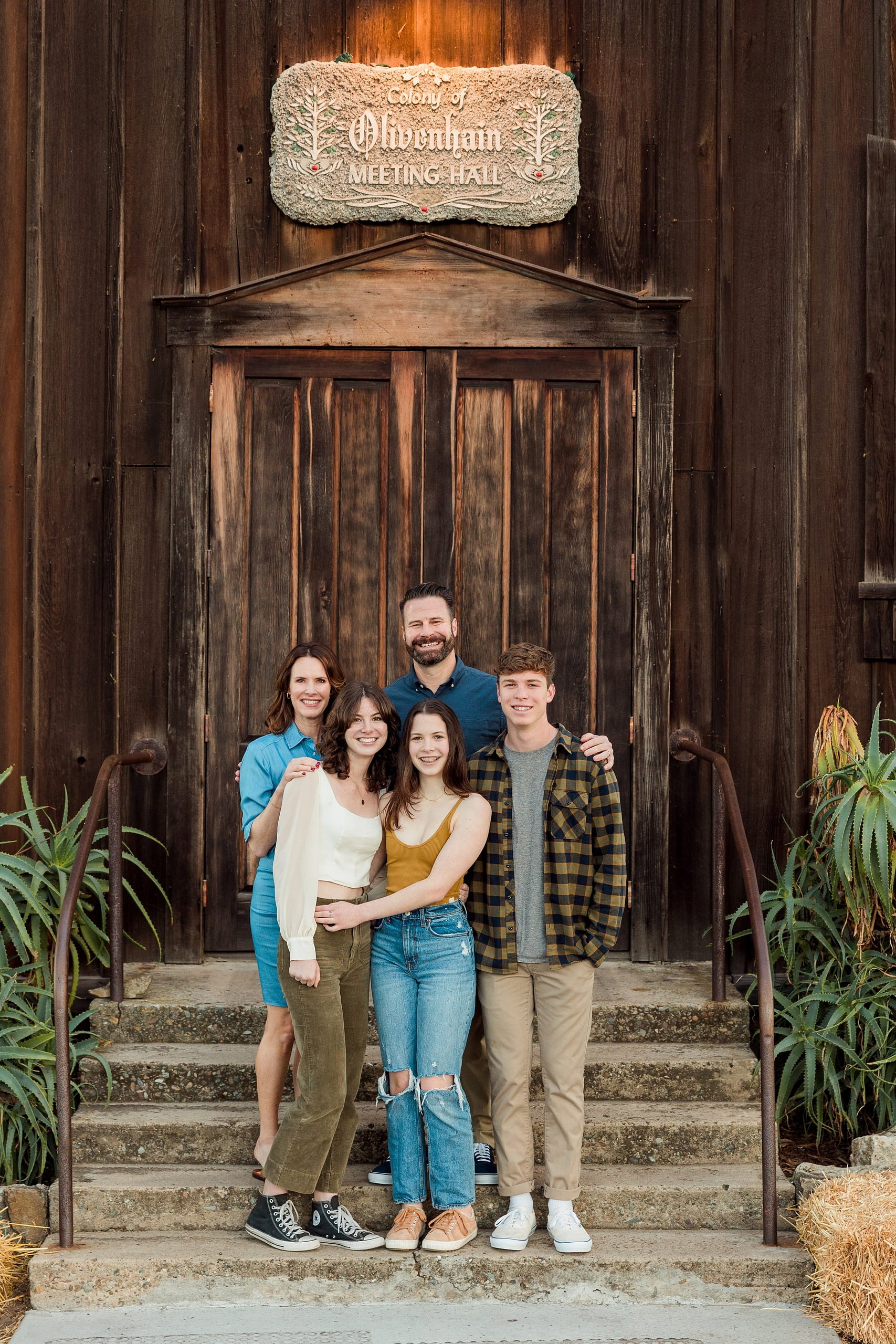 Photographer San Diego — 33 Family of five standing at Olivenhain Meeting Hall entrance with sign