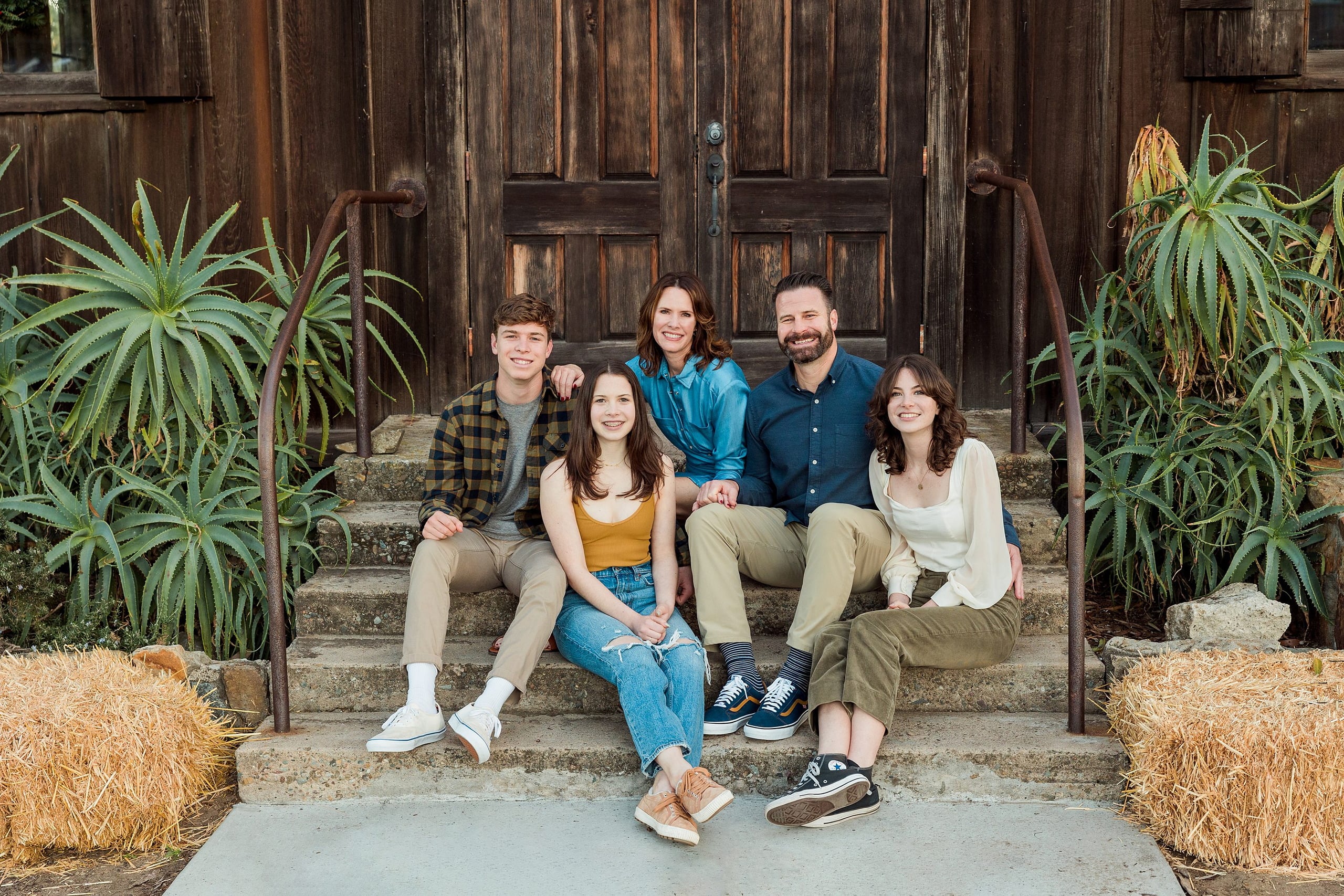 Photographer San Diego — 34 Family of five seated on steps at Meeting Hall, relaxed grouping