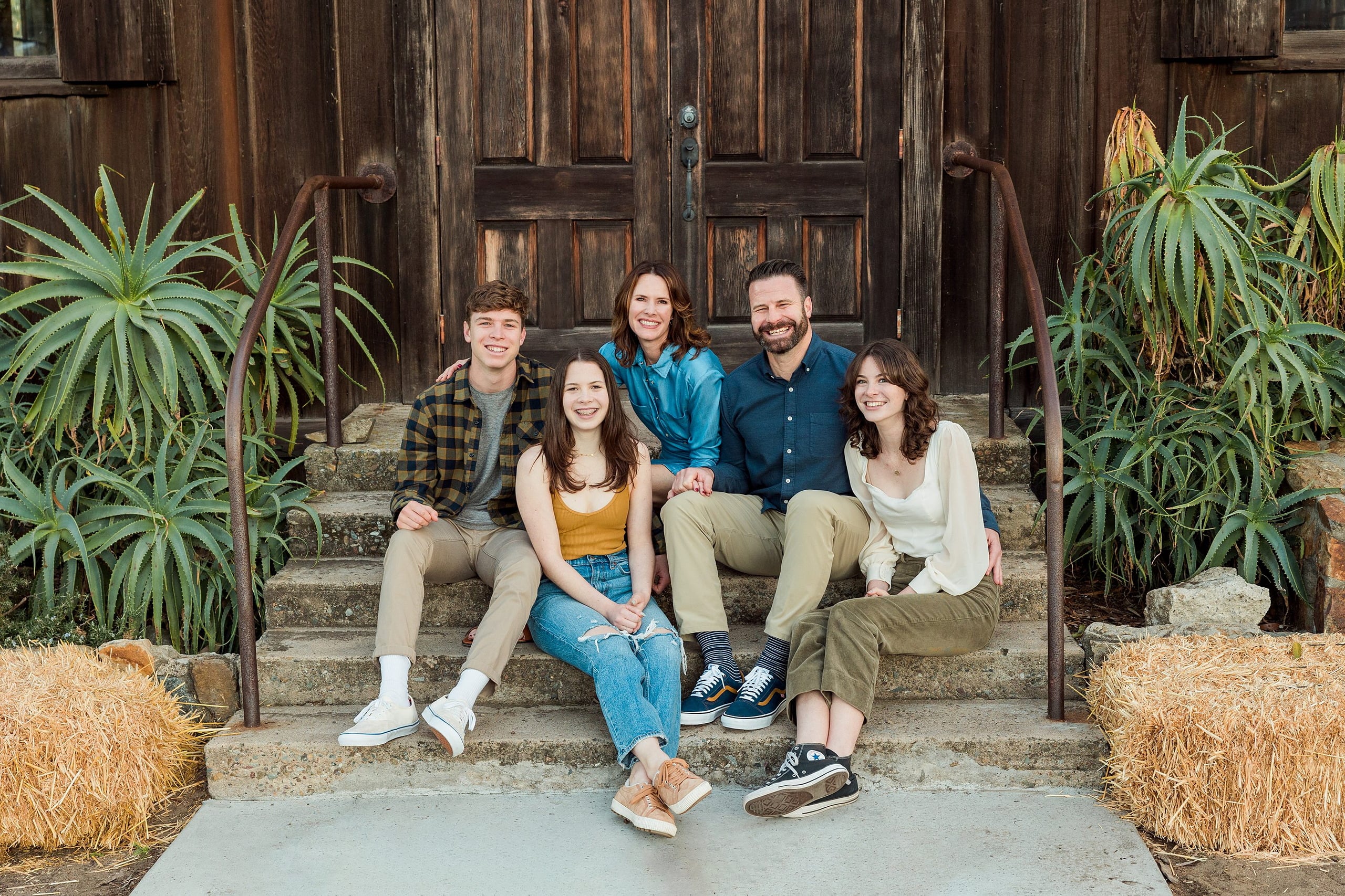 Photographer San Diego — 36 Family of five on steps at Meeting Hall with wide group arrangement