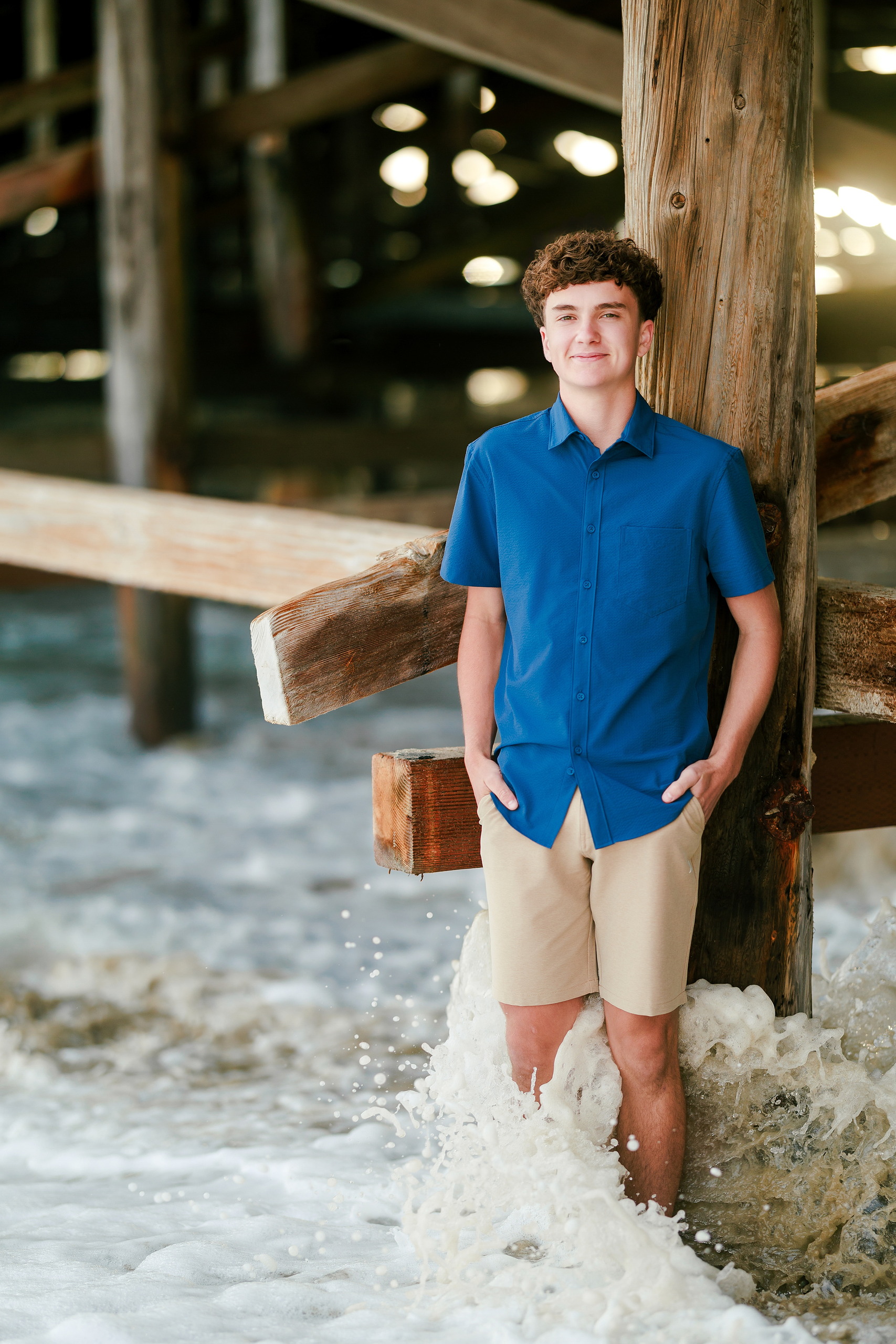 San Diego Beach Family Photos — 04 Teen in blue shirt wading in shallow water at Crystal Pier
