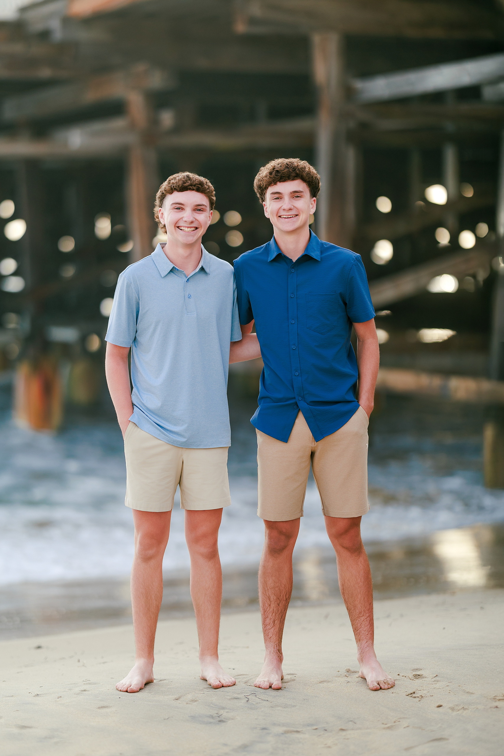 San Diego Beach Family Photos — 05 Two teen boys standing barefoot on wet sand at Crystal Pier