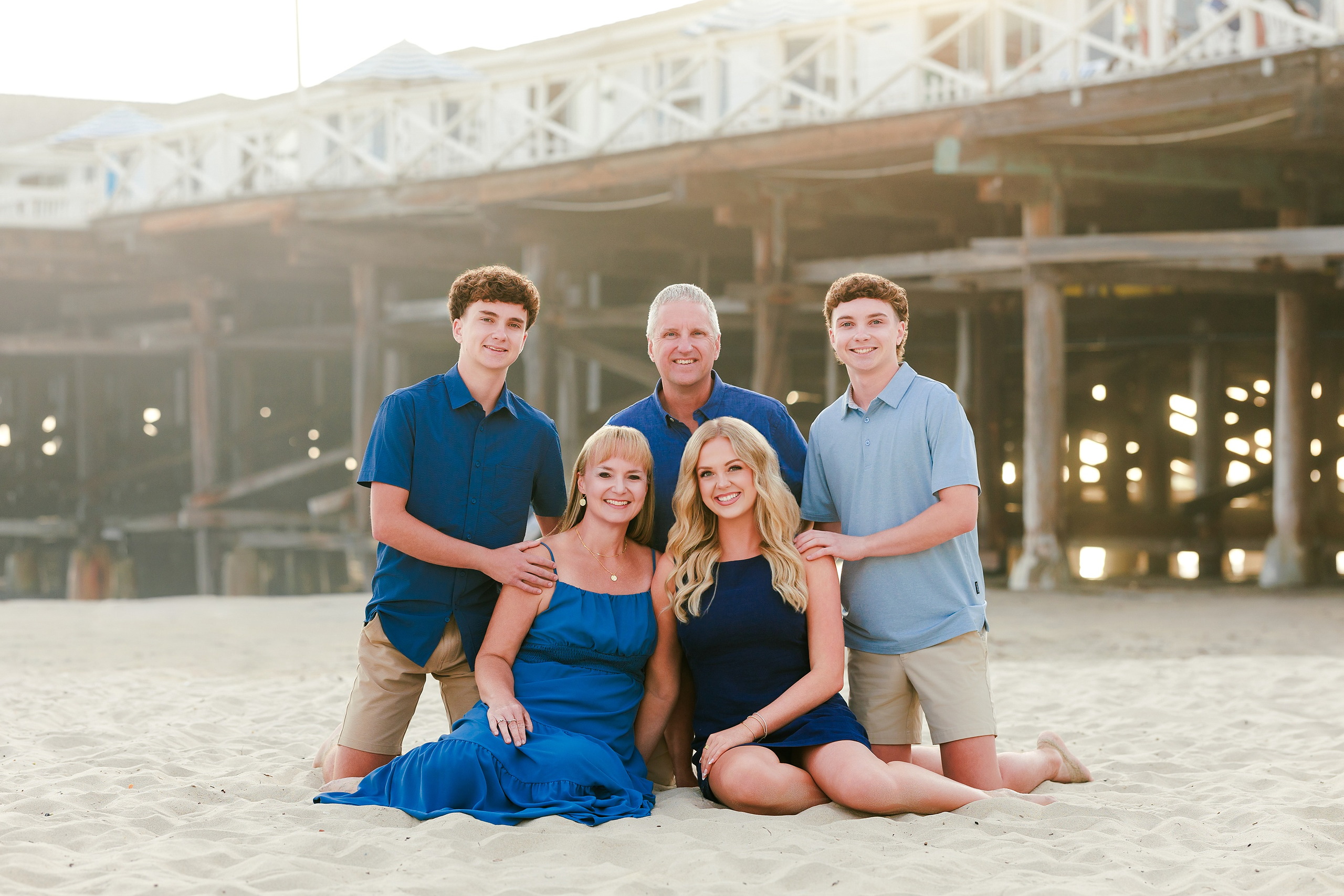 San Diego Beach Family Photos — 14 Five family members standing together on wet sand at beach