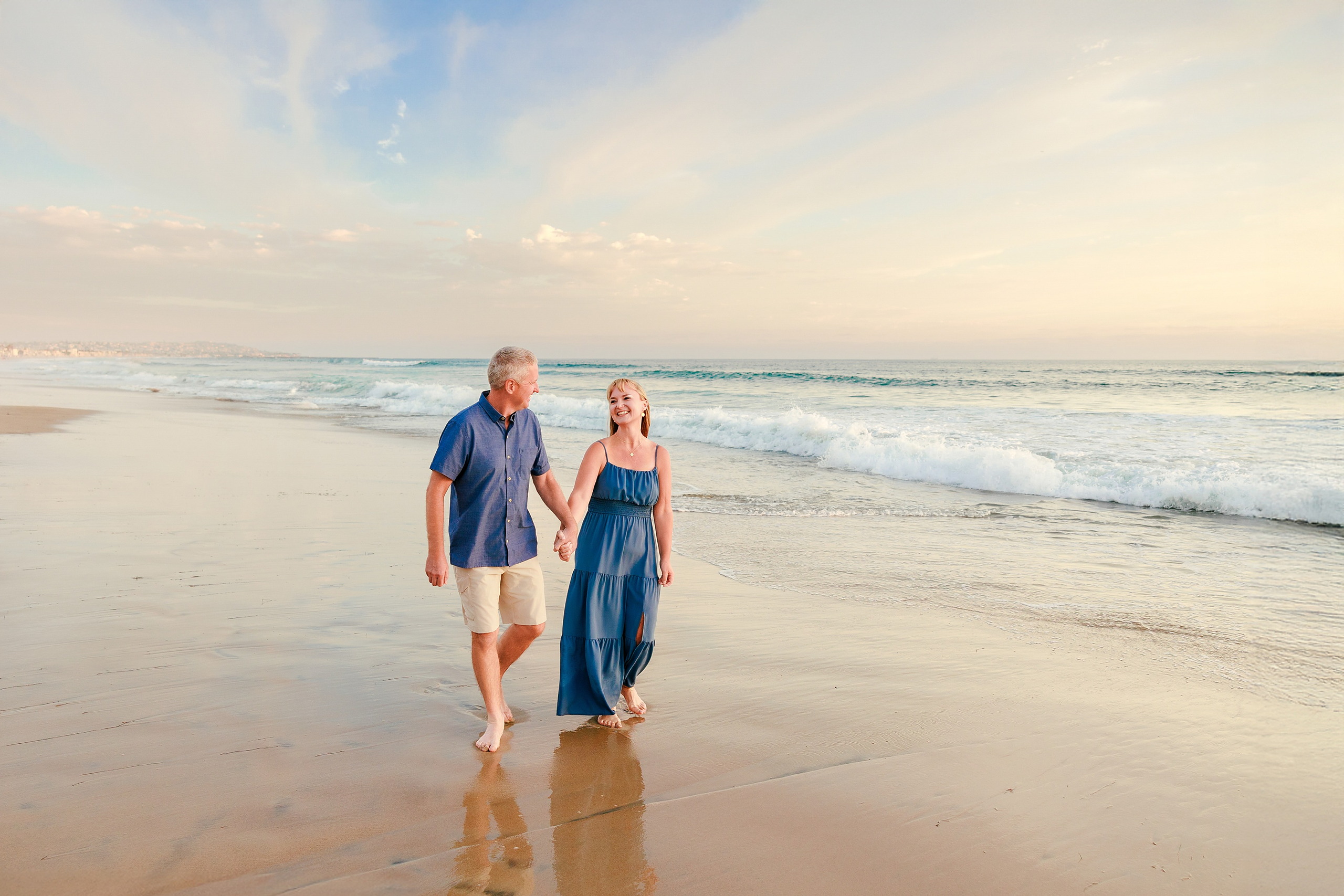 San Diego Beach Family Photos — 26 Adult couple walking hand in hand on the wet sand at shoreline
