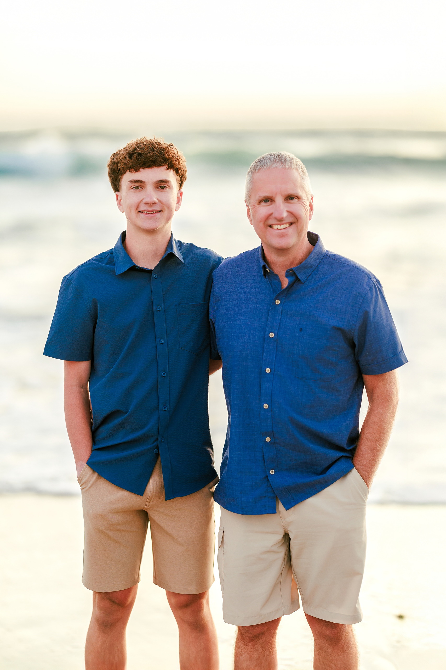 San Diego Beach Family Photos — 34 Two teenage boys standing side by side on beach near pier