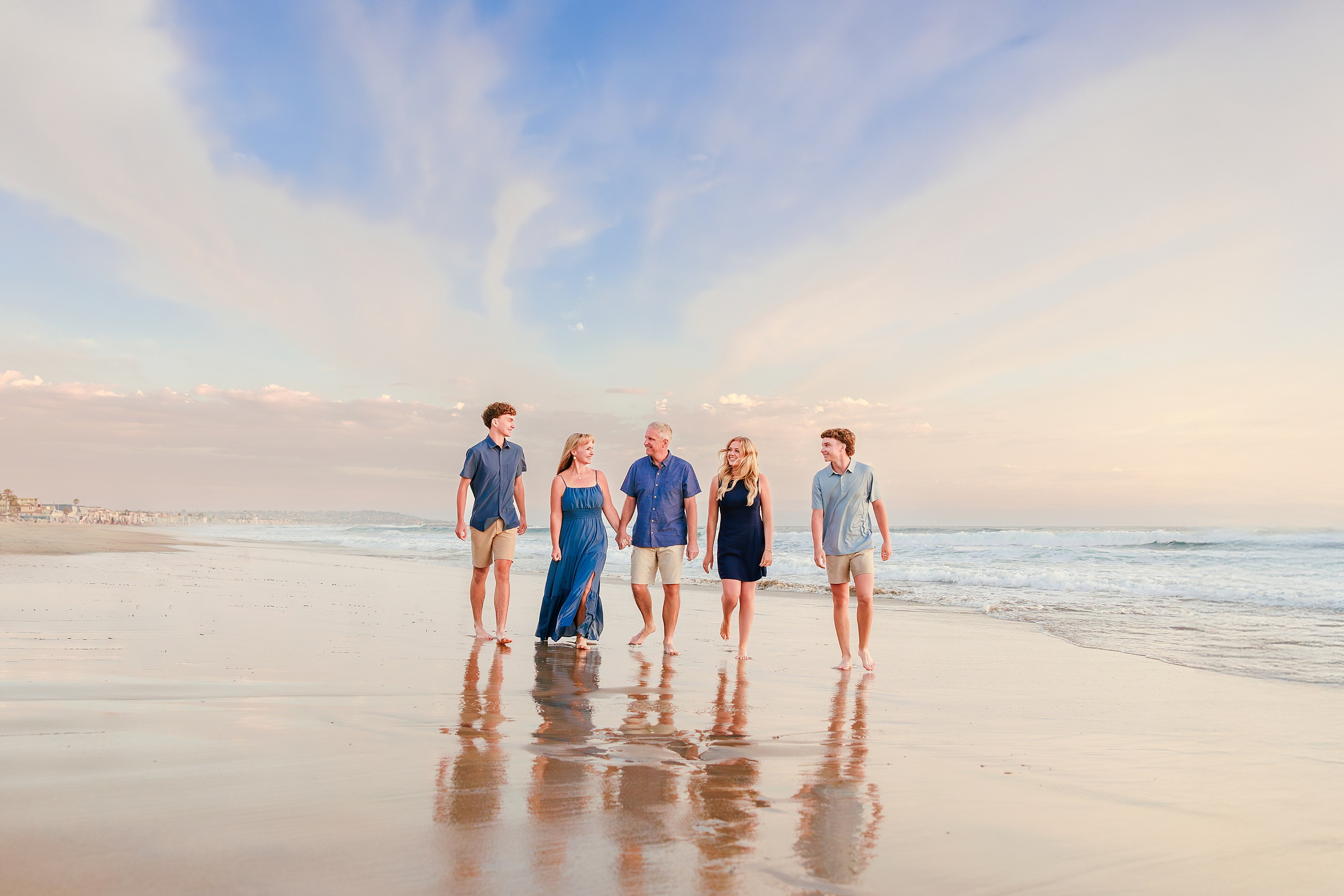 San Diego Beach Family Photos — 35 Five family members standing on wet sand with pier in distance