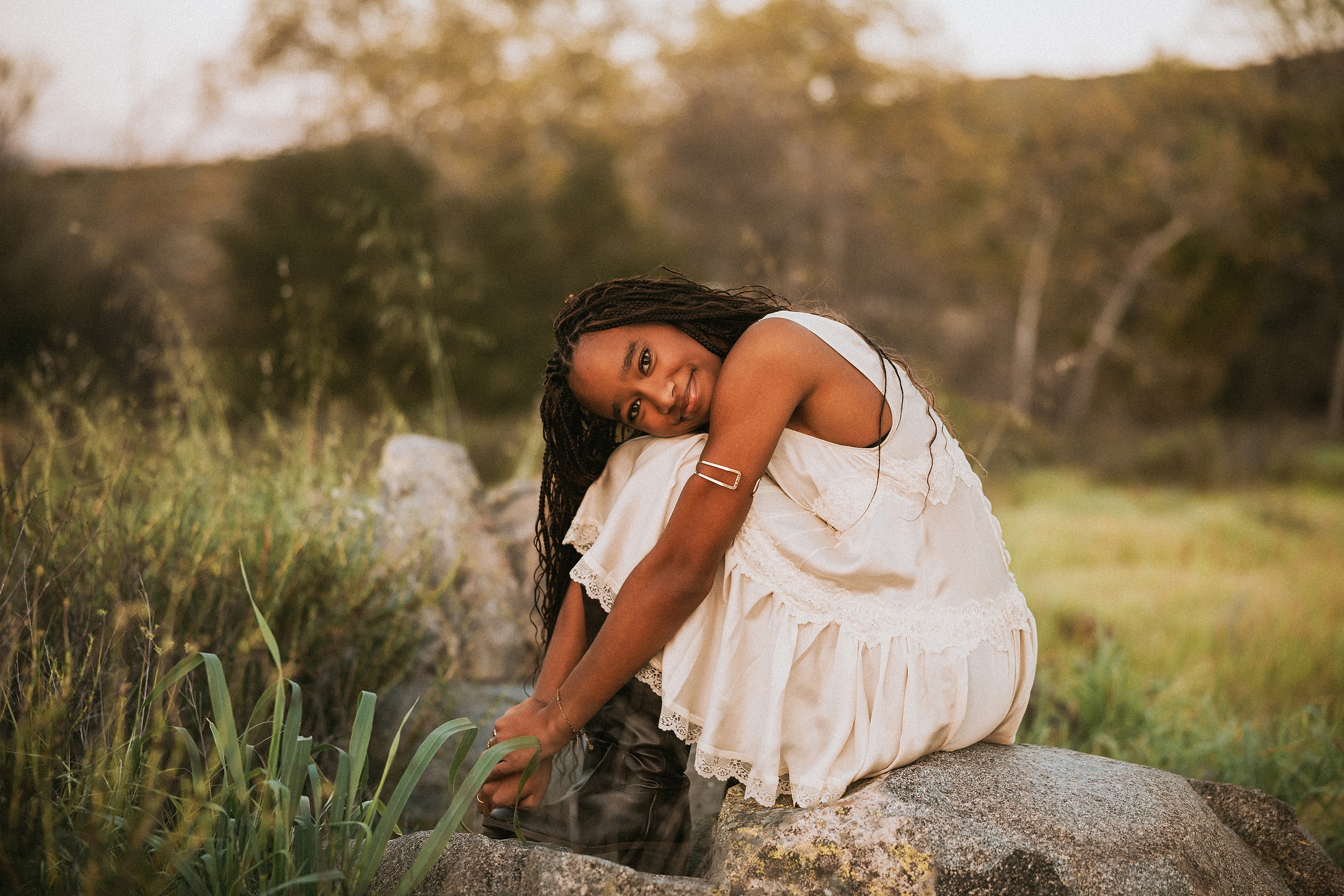 San Diego Senior Photos — 10 Kaelyn in denim overalls doing cartwheel across grassy field with hills
