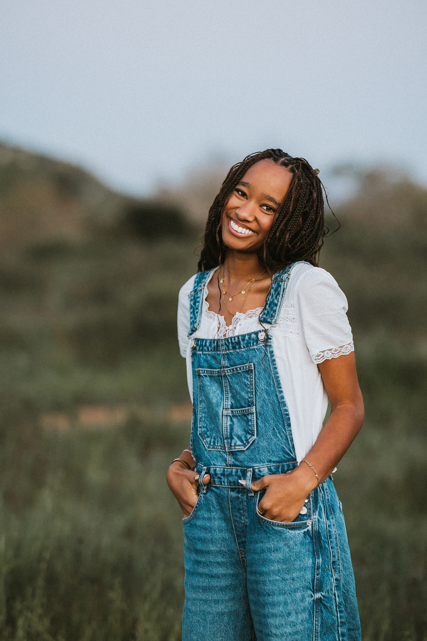 San Diego Senior Photos — 19 Kaelyn in white dress running through tall grass at sunset, golden hour