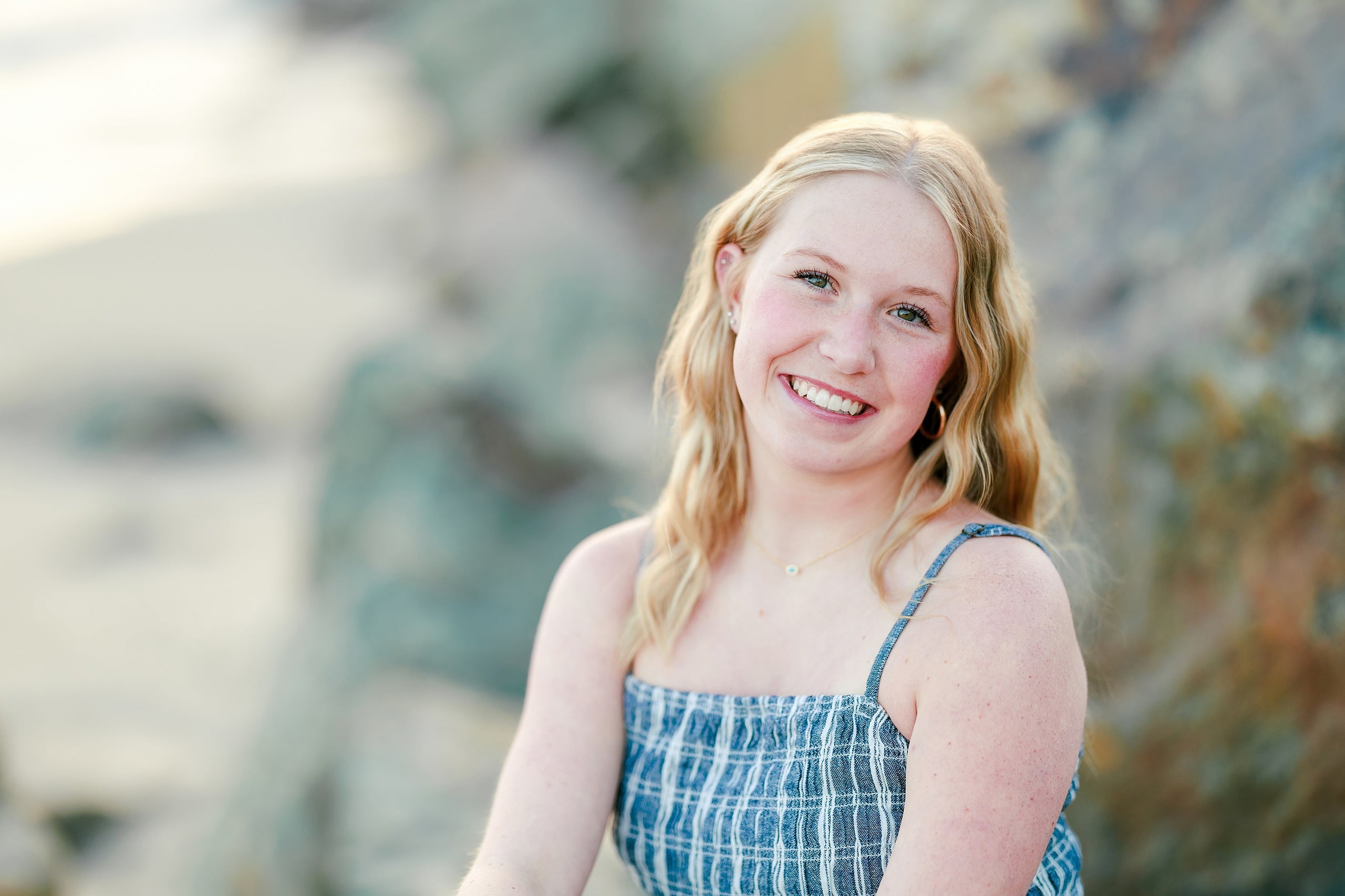 Sisters & Senior Portraits at the Del — 17 Teen in turquoise sweater sprinting along beach at sunset in profile