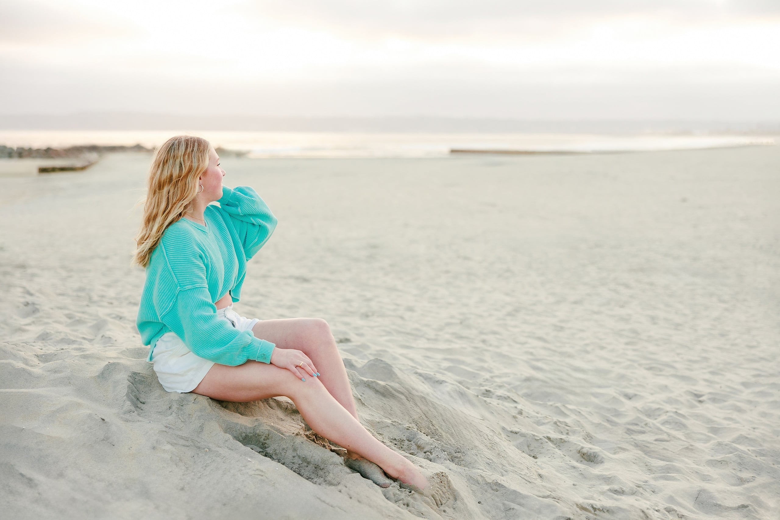 Sisters & Senior Portraits at the Del — 27 Sisters and parents holding hands while wading in shallow beach water