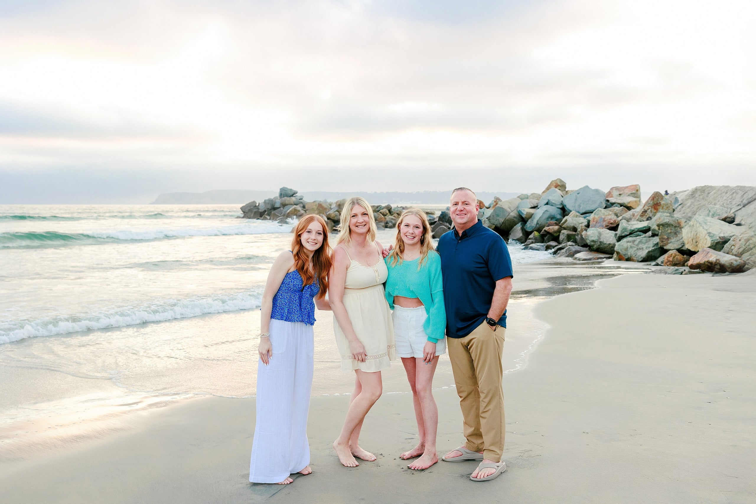 Sisters & Senior Portraits at the Del — 29 Two sisters playfully spinning together in shallow beach water at sunset