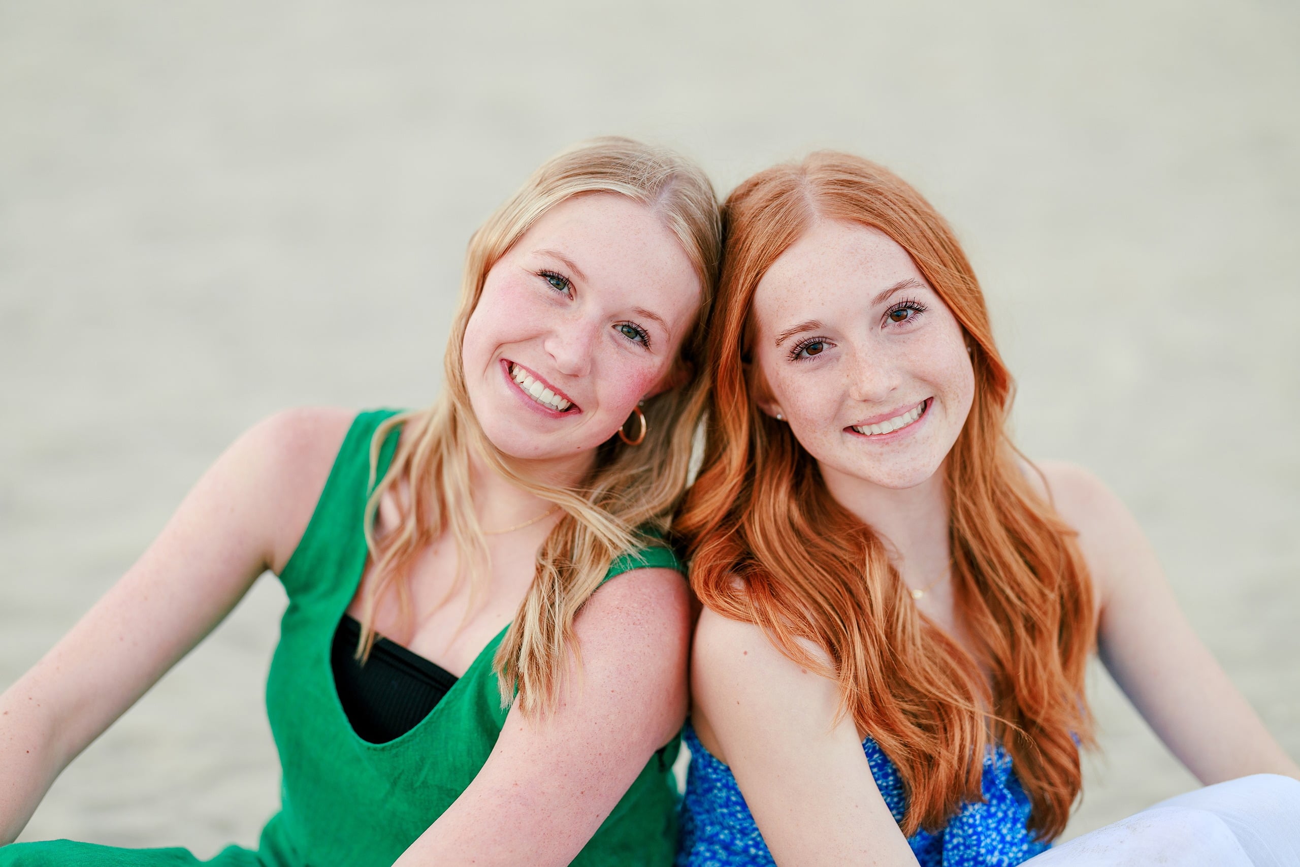 Sisters & Senior Portraits at the Del — 42 Close-up of two sisters smiling at camera, outdoors at beach location