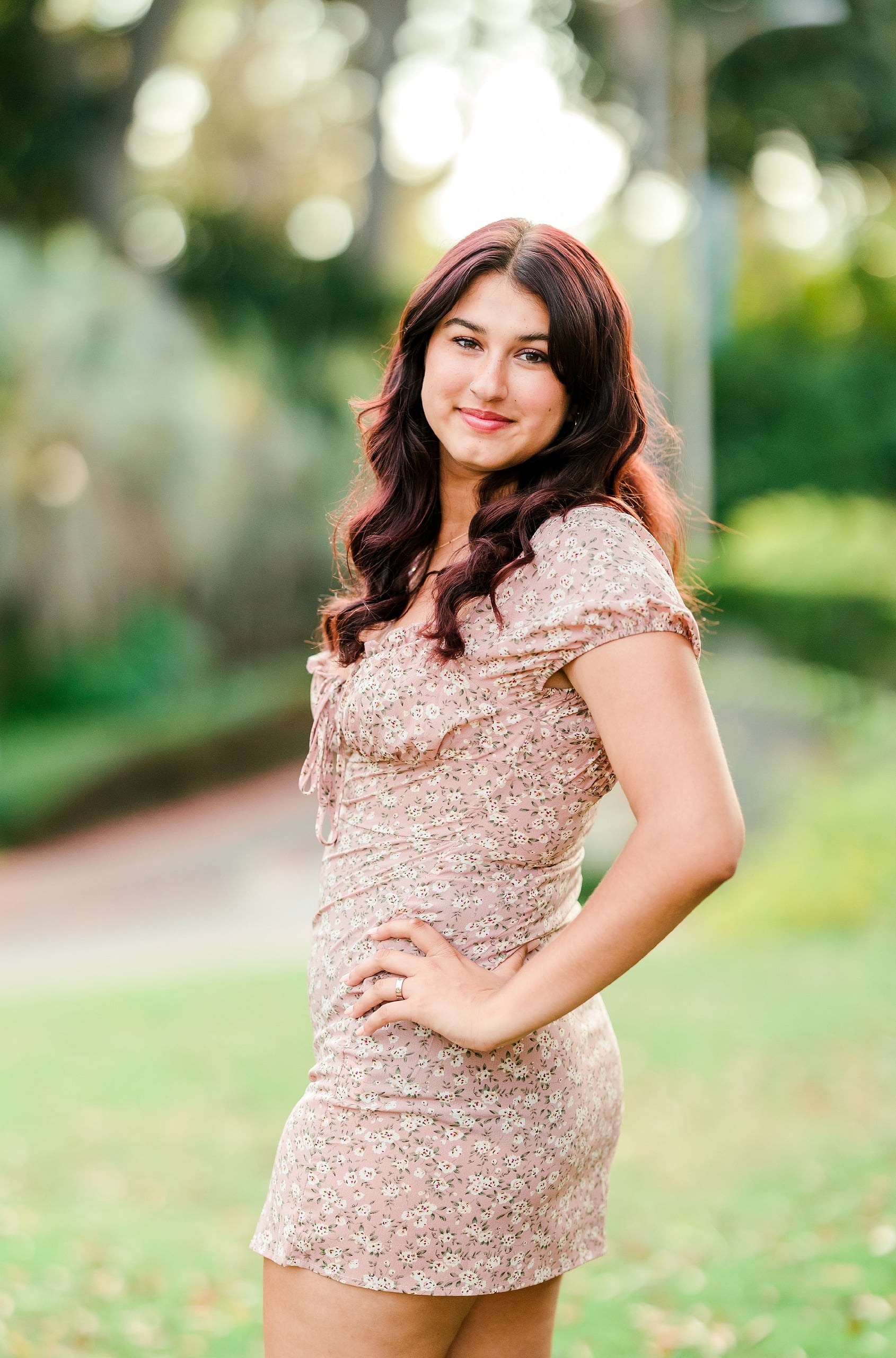 Sonia’s Senior Portraits in Balboa Park — 09 A teenager in a thoughtful, posed portrait session moment at the park