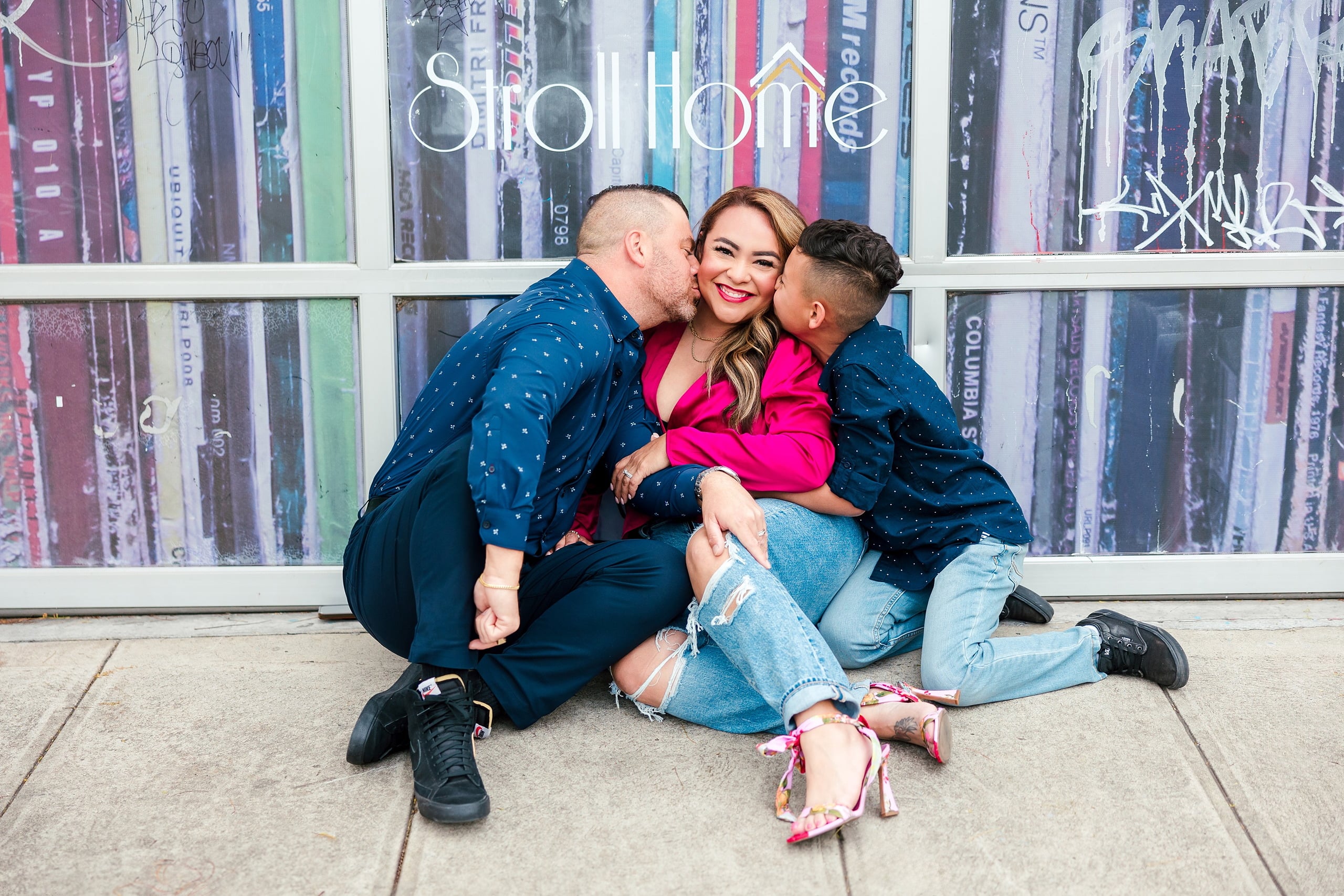 Spring Break Surprise: Why This Mom Booked a Secret Photo Session — 08 Man and woman embrace before vibrant street art in Little Italy