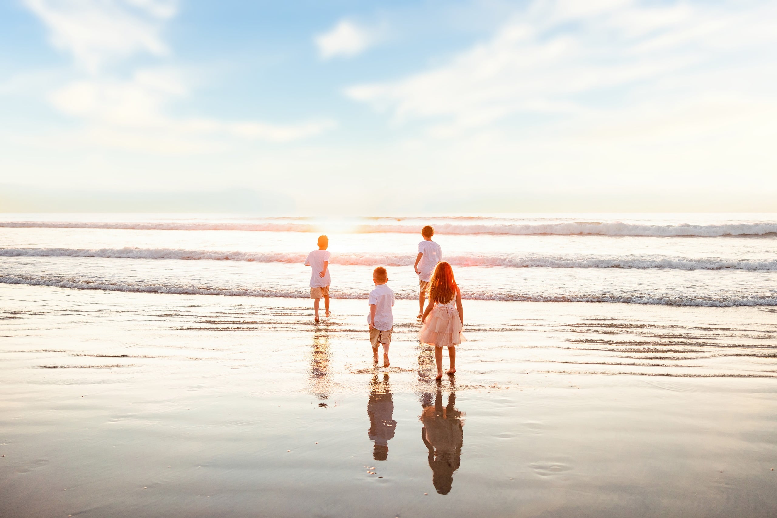 The Day the Sun Stood Still — 27 Four children standing together in shallow ocean waves at Del Mar beach
