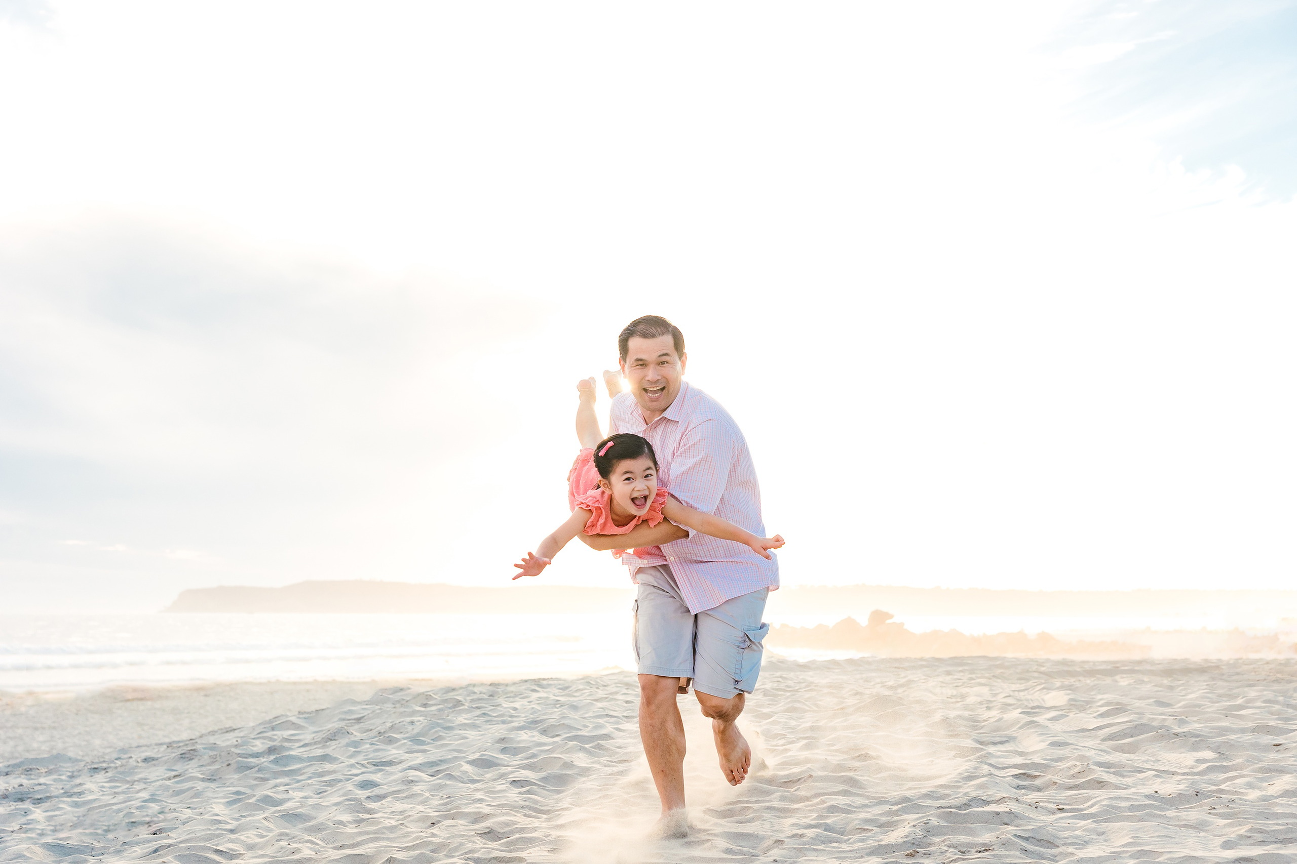 Turning Five on Coronado — 14 Dad carrying Ava on shoulders while running on the sandy Coronado beach