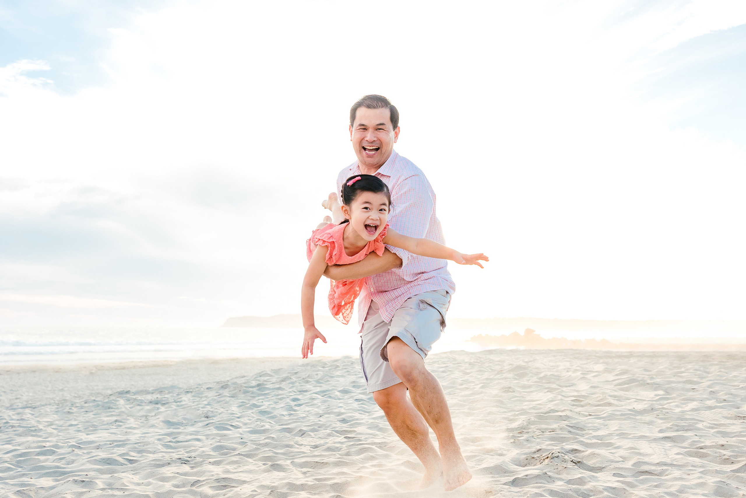 Turning Five on Coronado — 15 Dad jogging happily with Ava on his shoulders at Hotel del Coronado beach