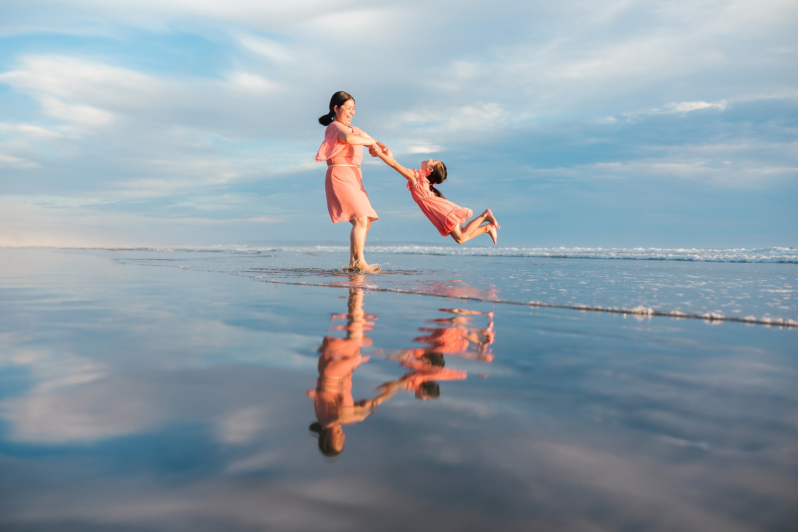 Turning Five on Coronado — 18 Mom and Ava playing together in shallow water at golden hour on beach