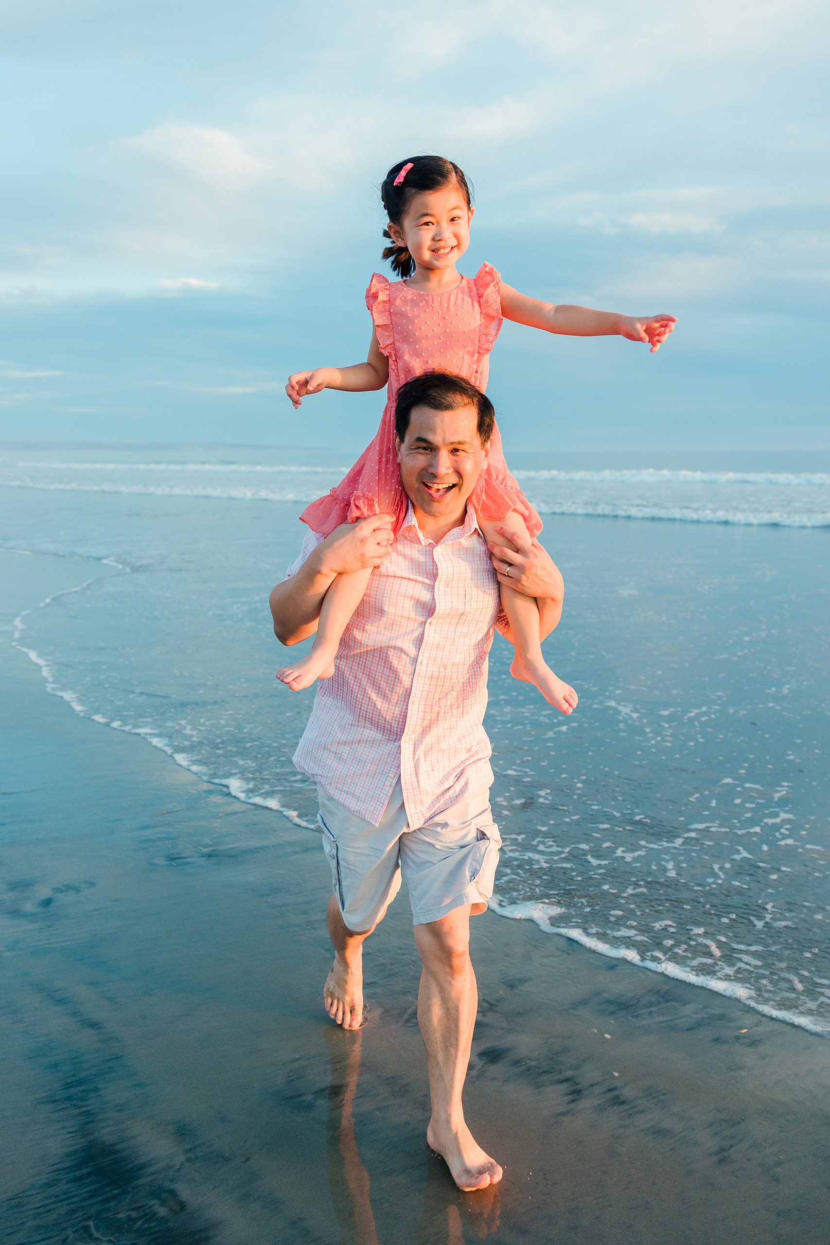 Turning Five on Coronado — 23 Dad carrying Ava on shoulders in shallow water, both smiling brightly
