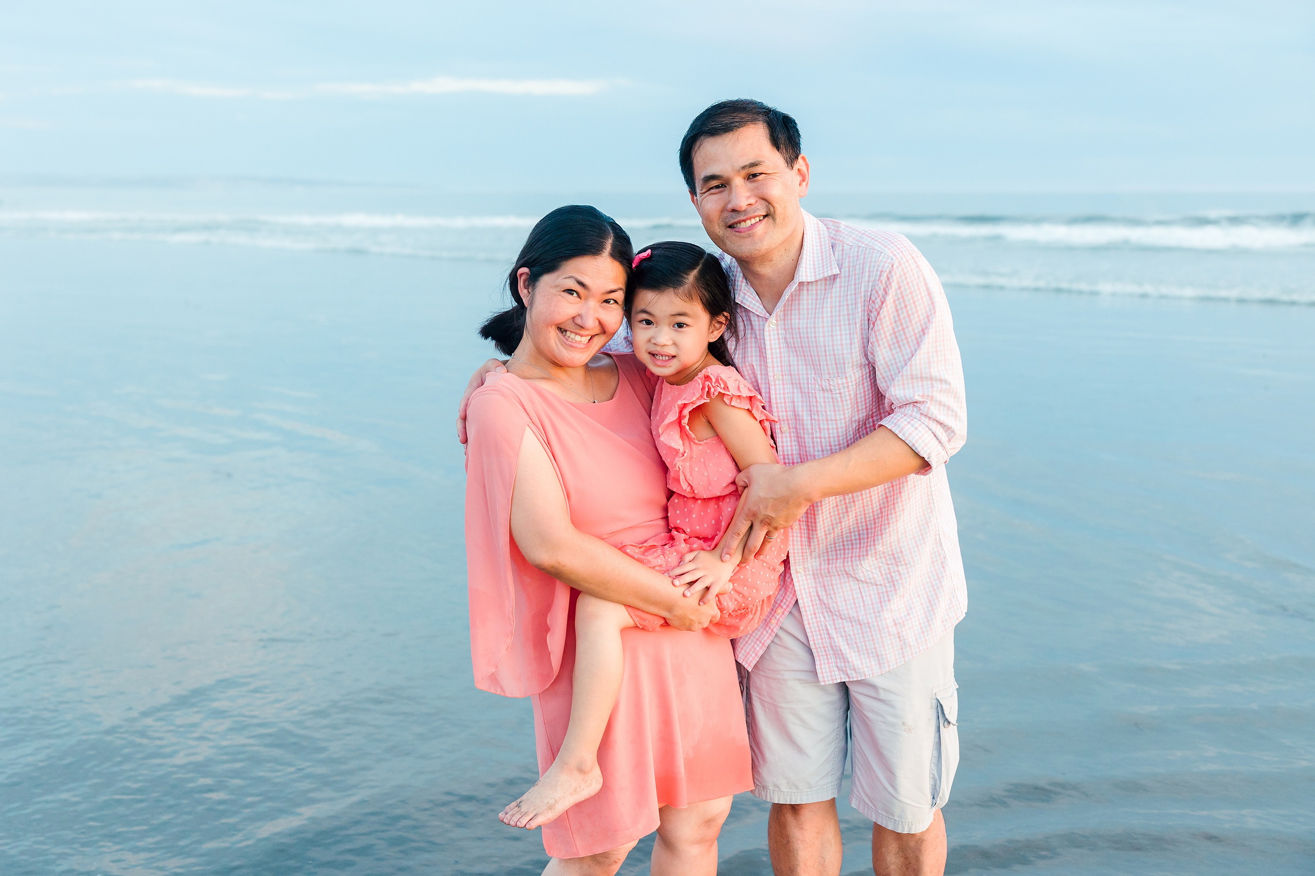 Turning Five on Coronado — 29 Ava and her parents standing together in shallow beach water