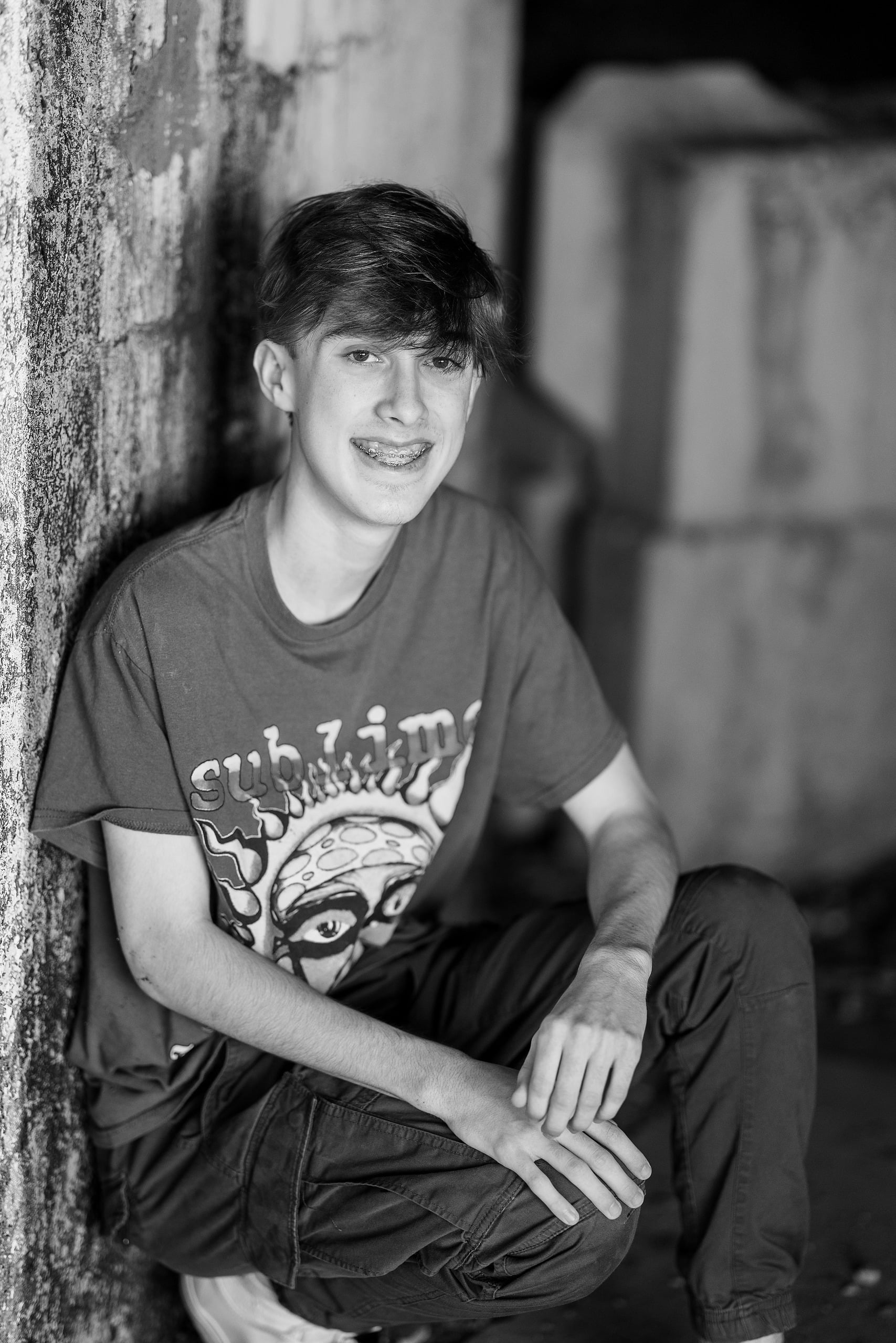 Zach’s Senior Portraits — 09 Close-up detail of Zach smiling, black and white photograph