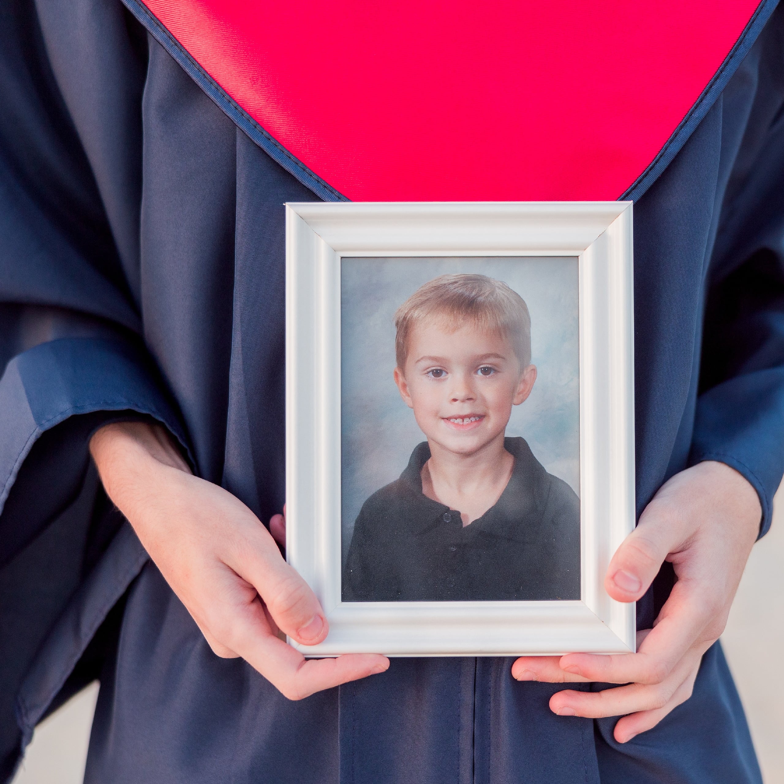 Zach’s Senior Portraits — 23 Close-up detail of blue and red graduation tassel with 2023