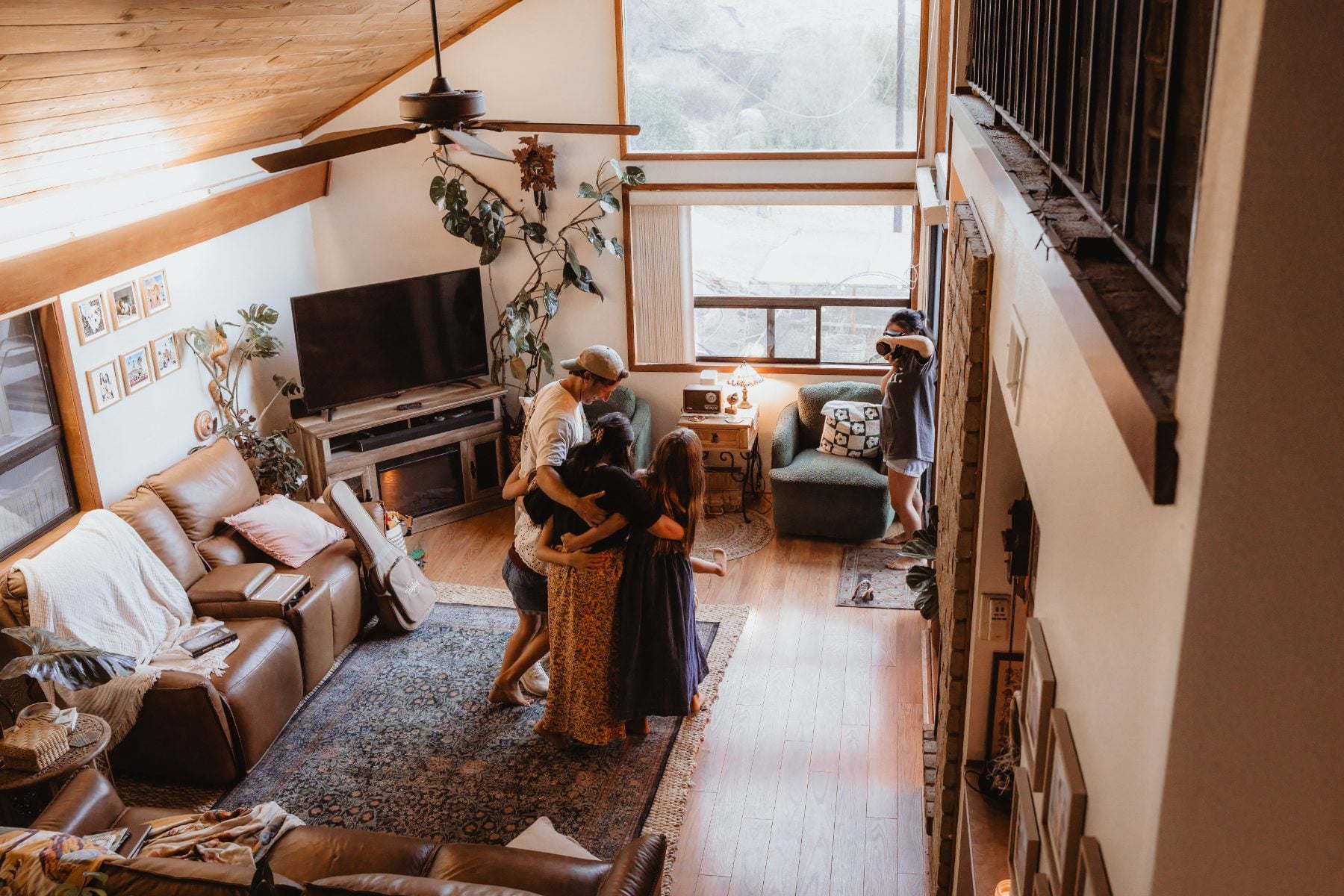 Overhead view of a family gathered in a cozy Lakeside living room