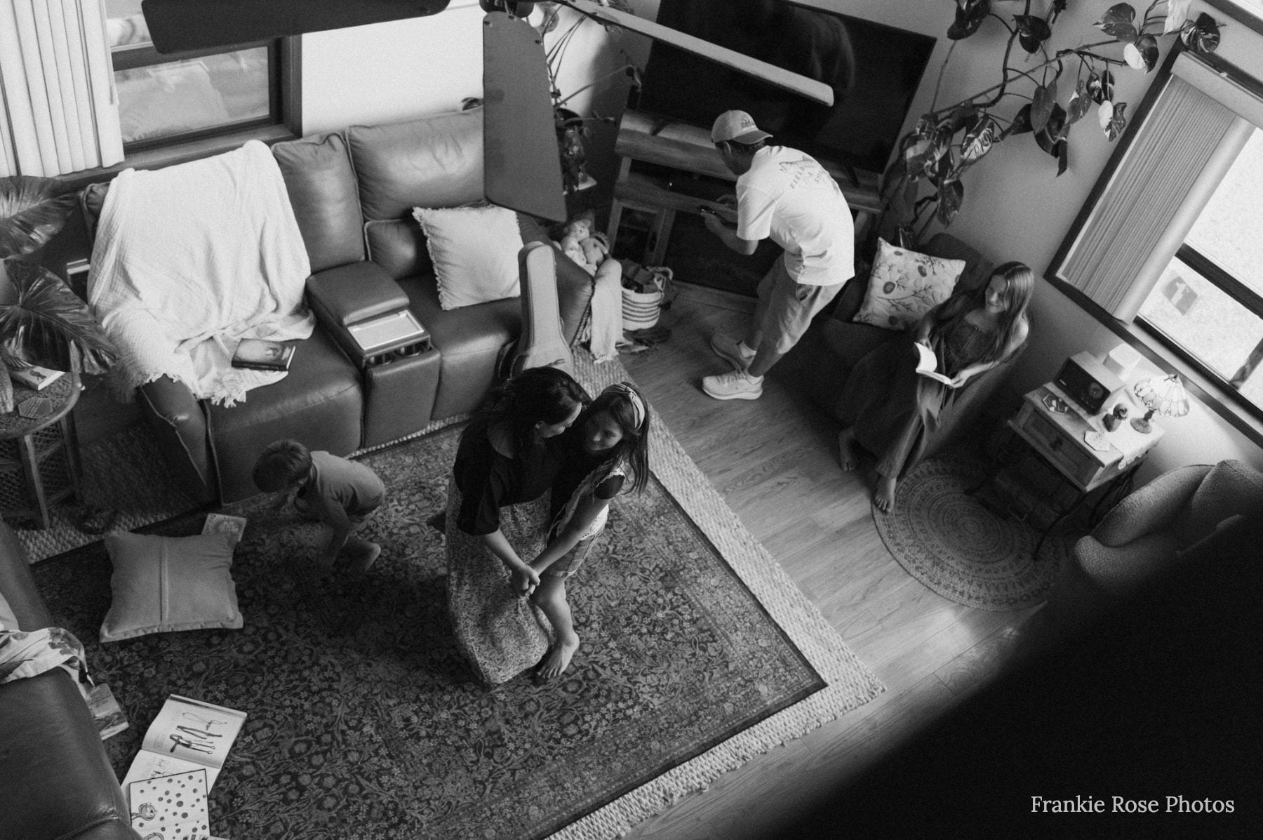 Overhead shot of family gathered in living room, San Diego family photographer moment