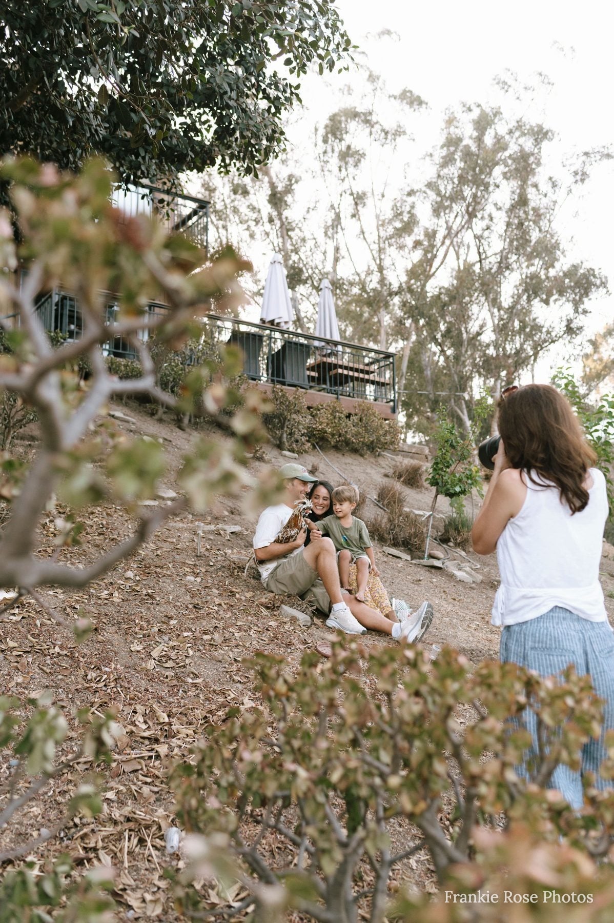 San Diego family photographer photographs family on a hillside in Lakeside